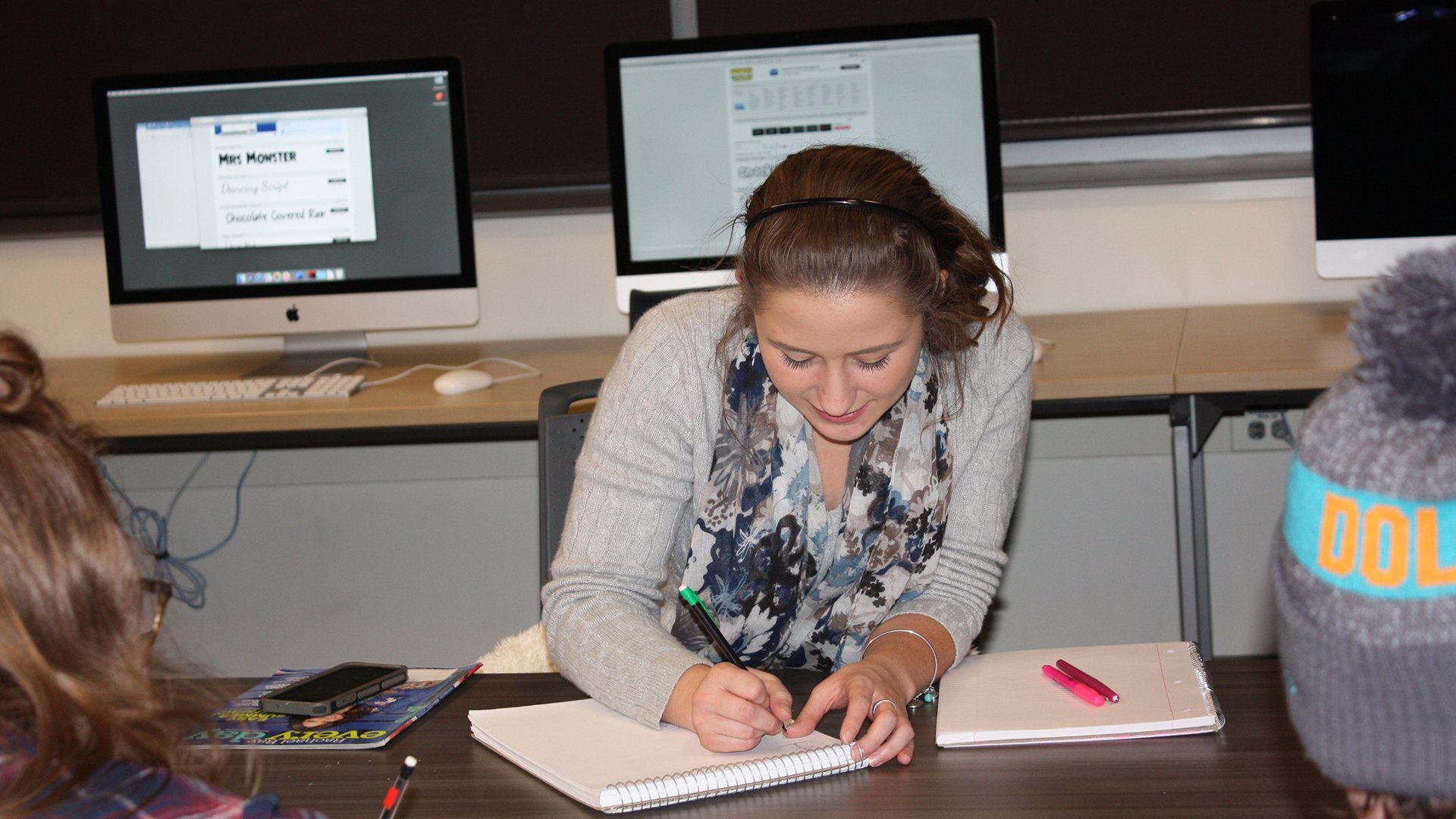 BGSU advertising students brainstorm content ideas for magazine advertising courses in small class groups on the Ohio campus.