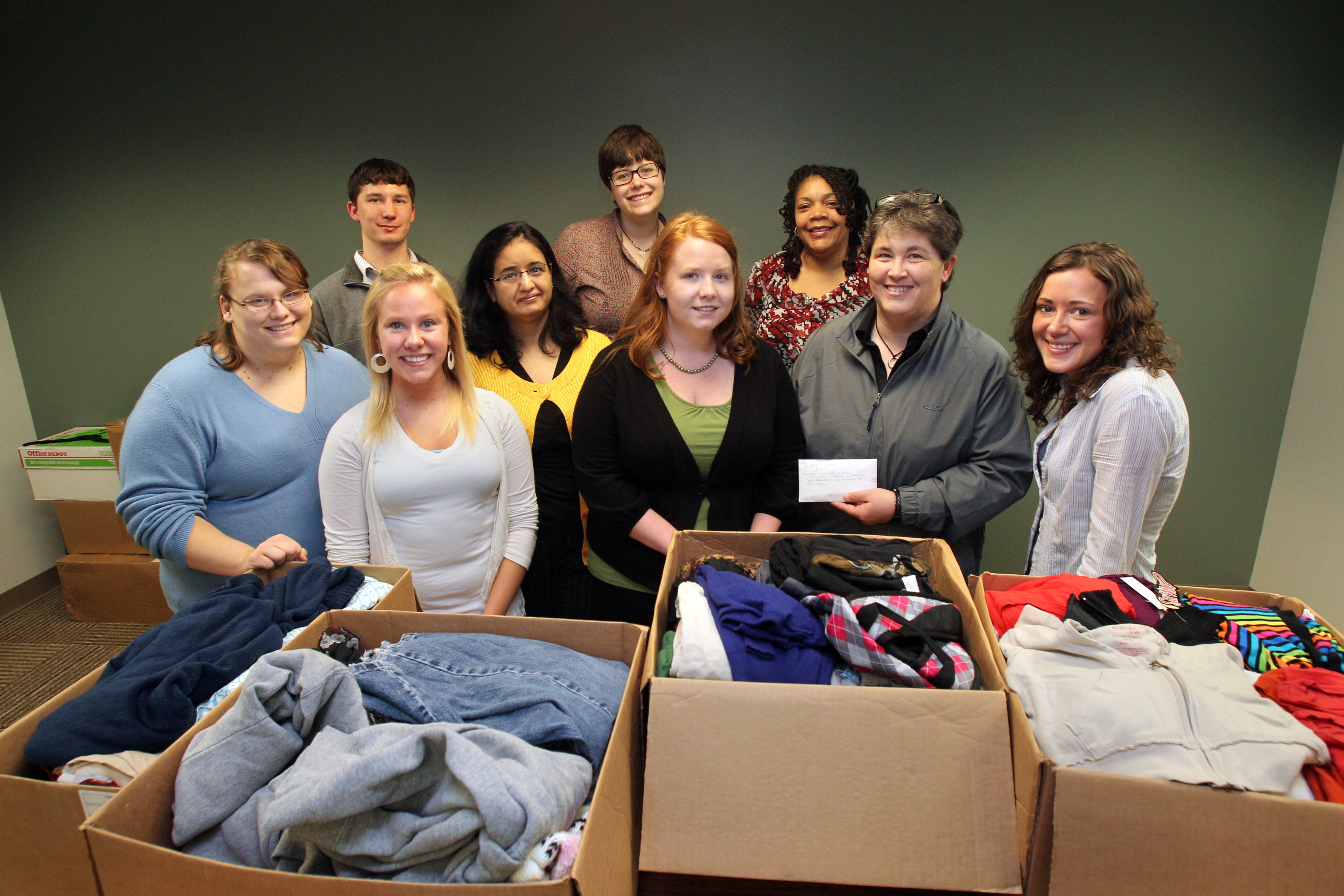 Group of social work students and professors smile