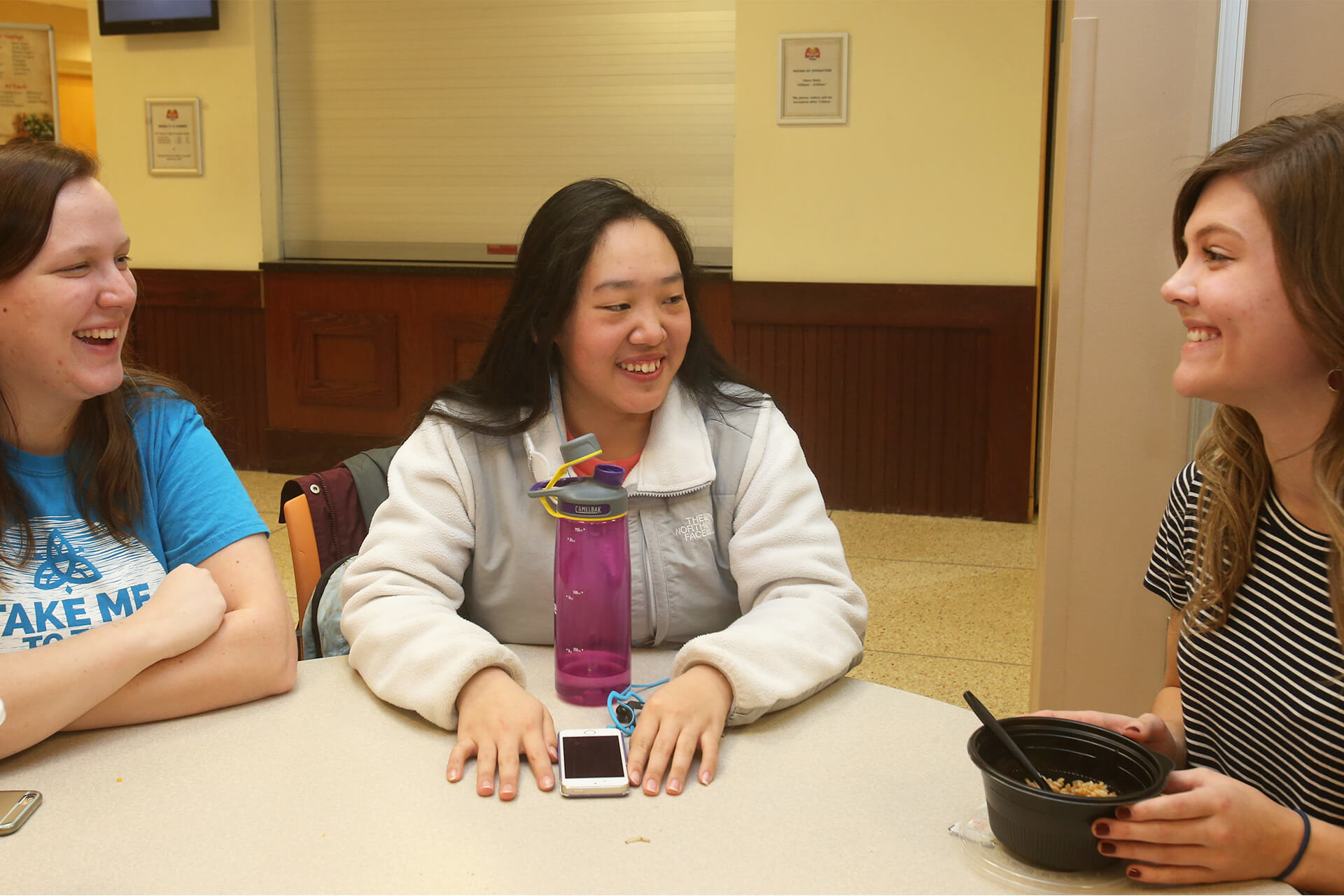 3 social work students are sitting and smiling