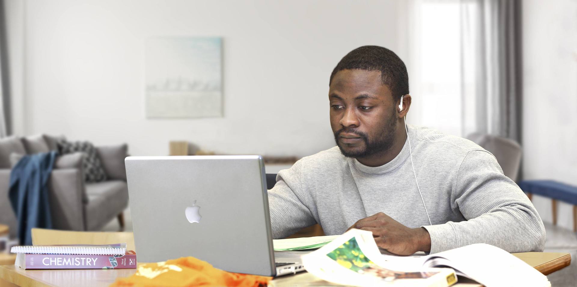 Student working on a computer at home