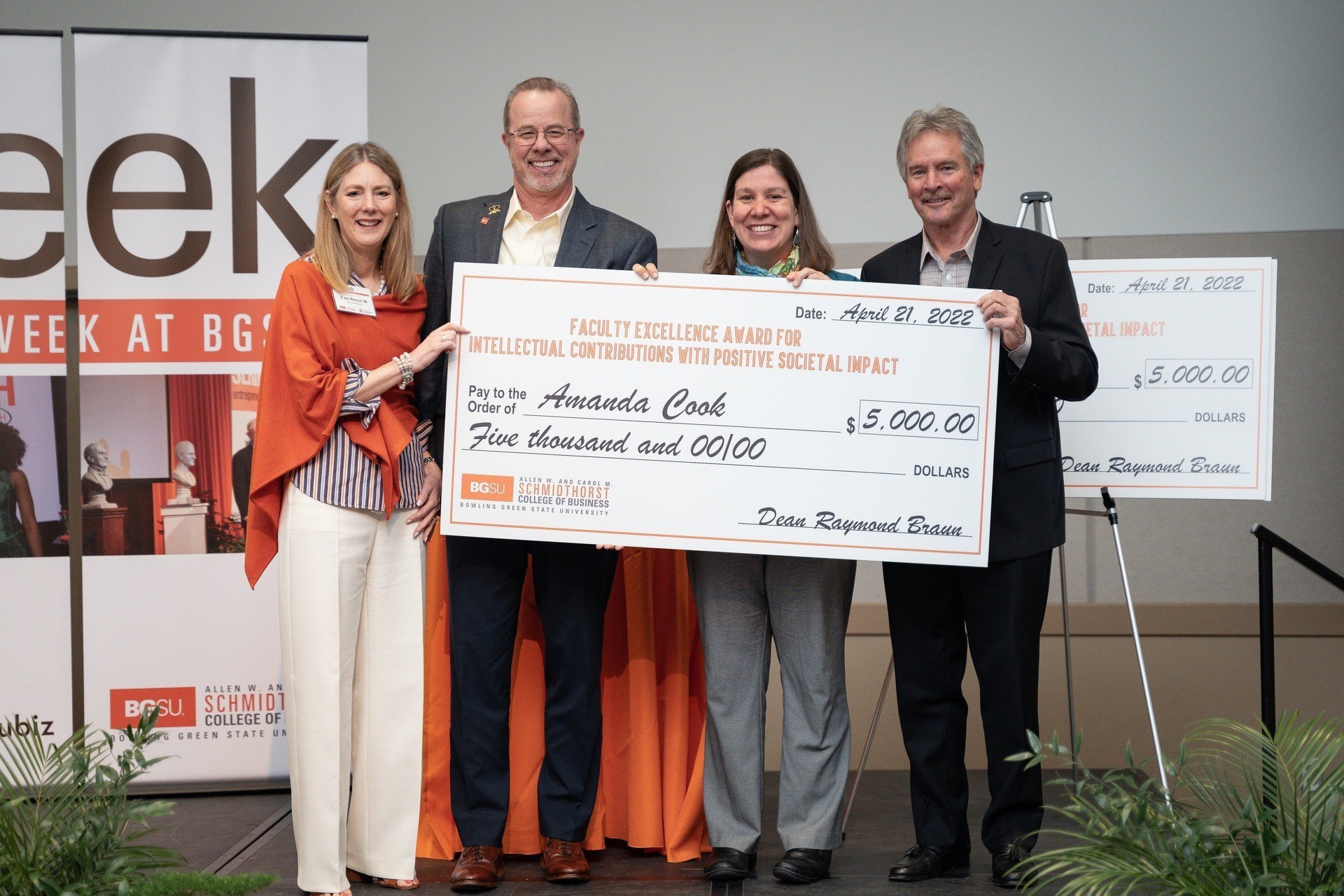 Amanda Cook receiving 2022 Faculty Excellence Award. Pictured left to right: D'Aun Norman, Chris Corwin, Amanda Cook, Michael Laming