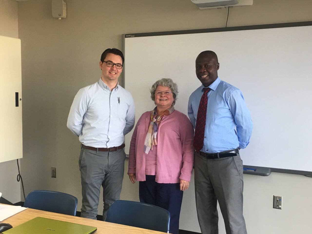 A picture of co-chairs Dr. Dan Bommarito and Dr. Sue Carter Wood with Stephen Ohene-Larbi