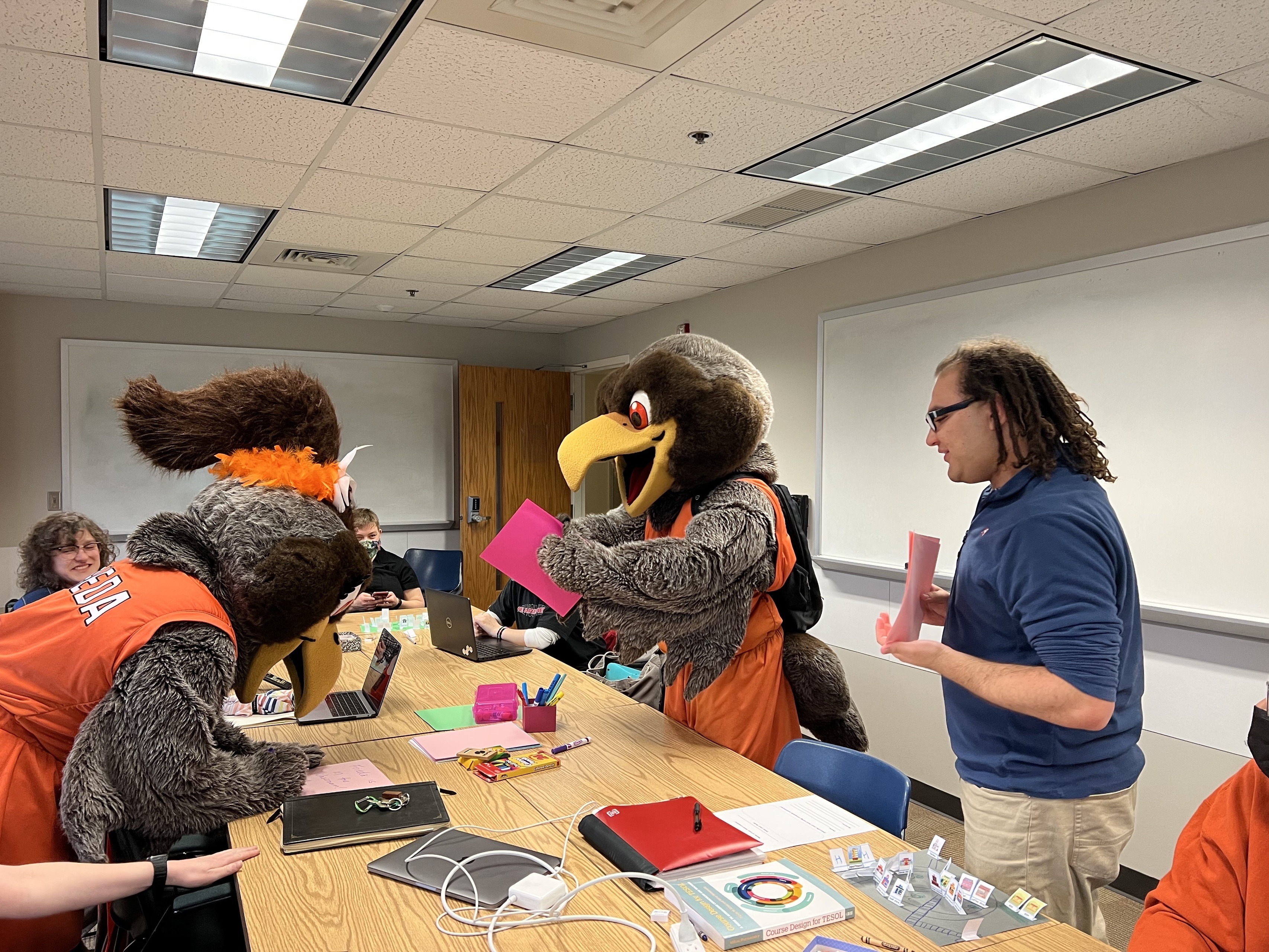 Students look on as Freddie and Frieda participate in an ESOL Methods class