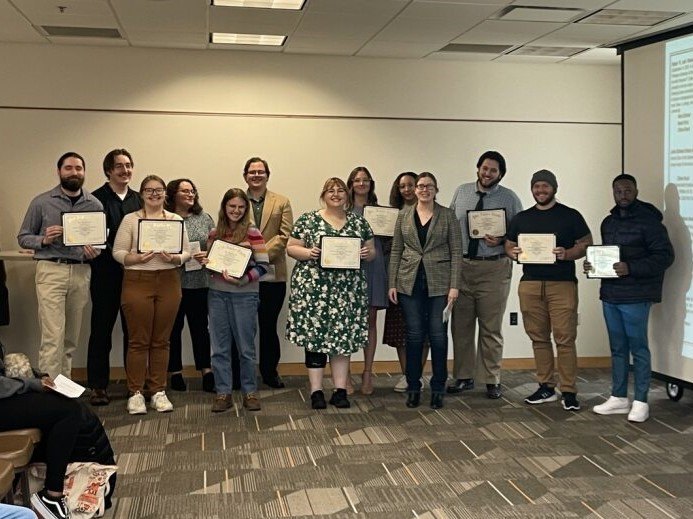 Group of history students holding their awards during the spring 2023 awards ceremony