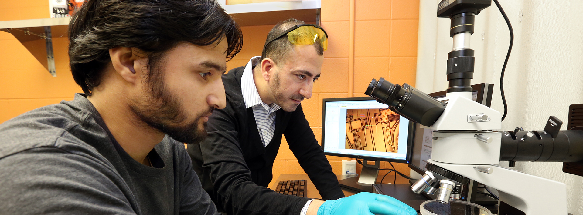 photo of student working in the lab with an instructor