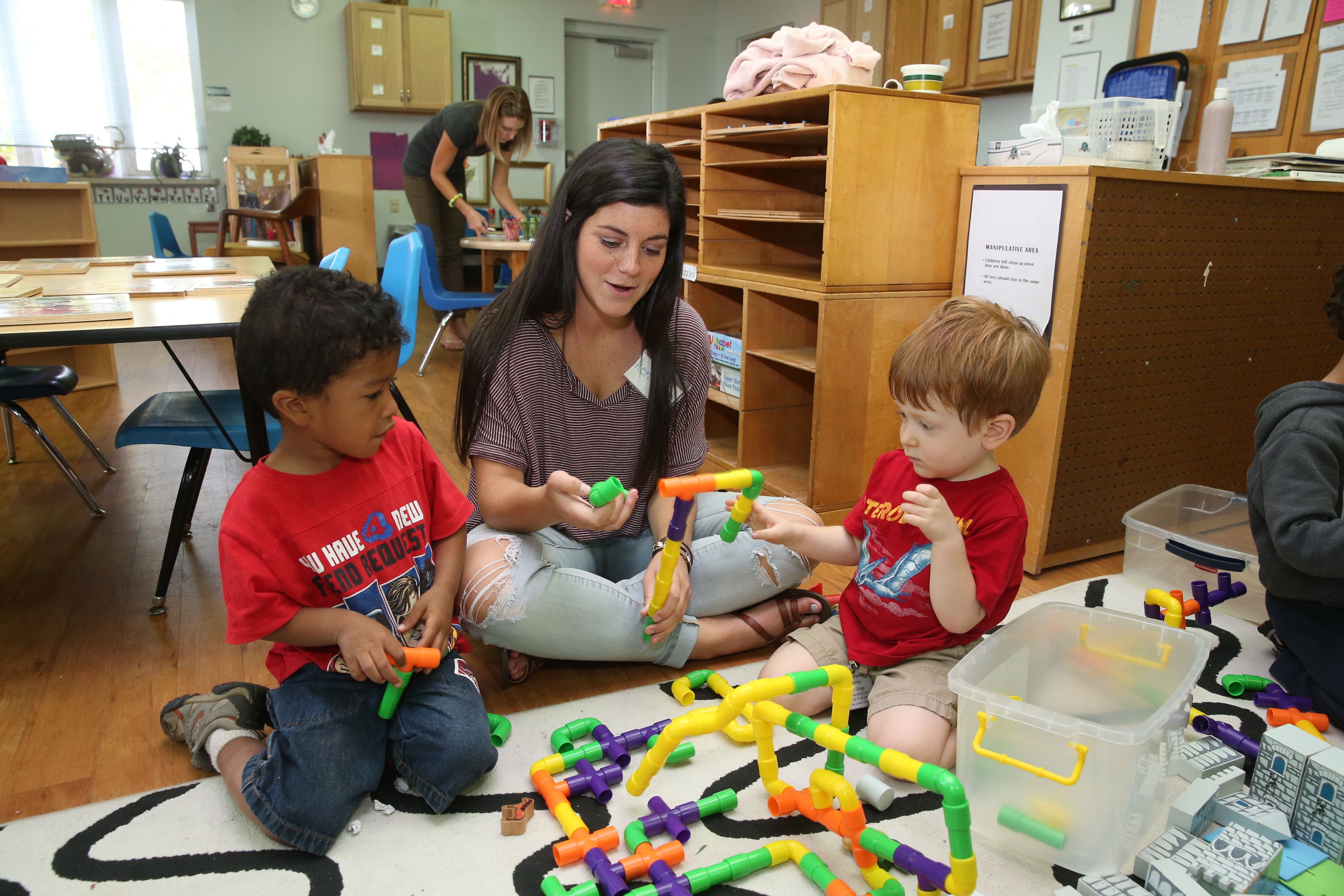 student-with-children-playing