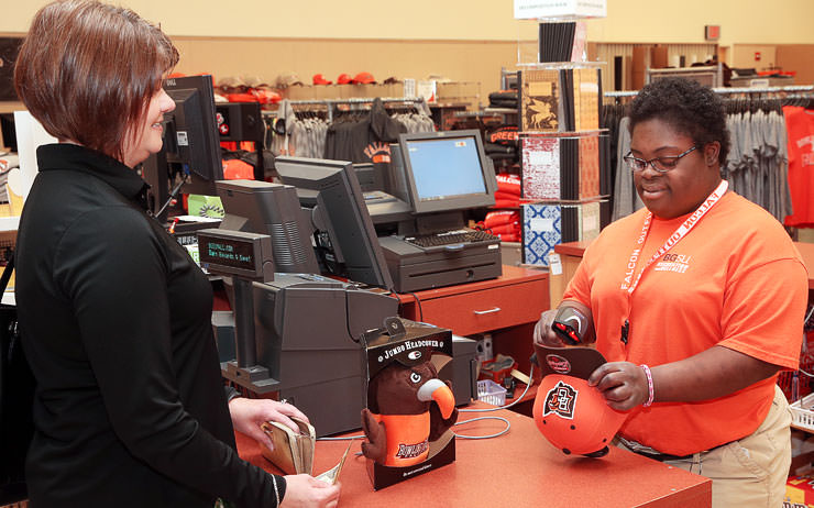 Student working at a cash register