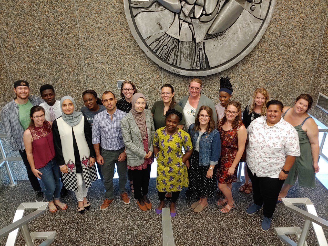 MACIE students stand in the Education building stairway for a group photo, 2019