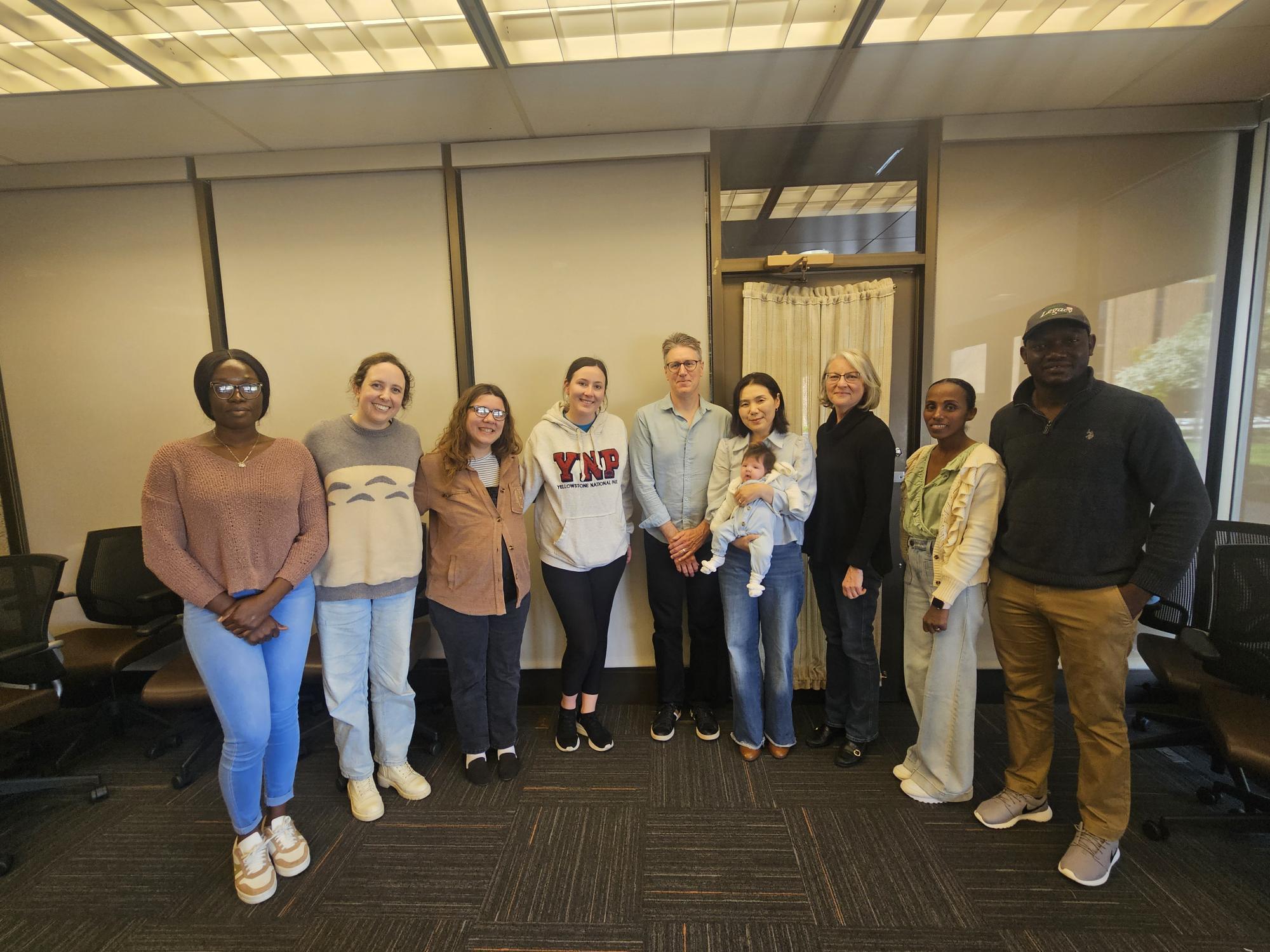 MACIE students stand in the Education building  for a group photo, 2024