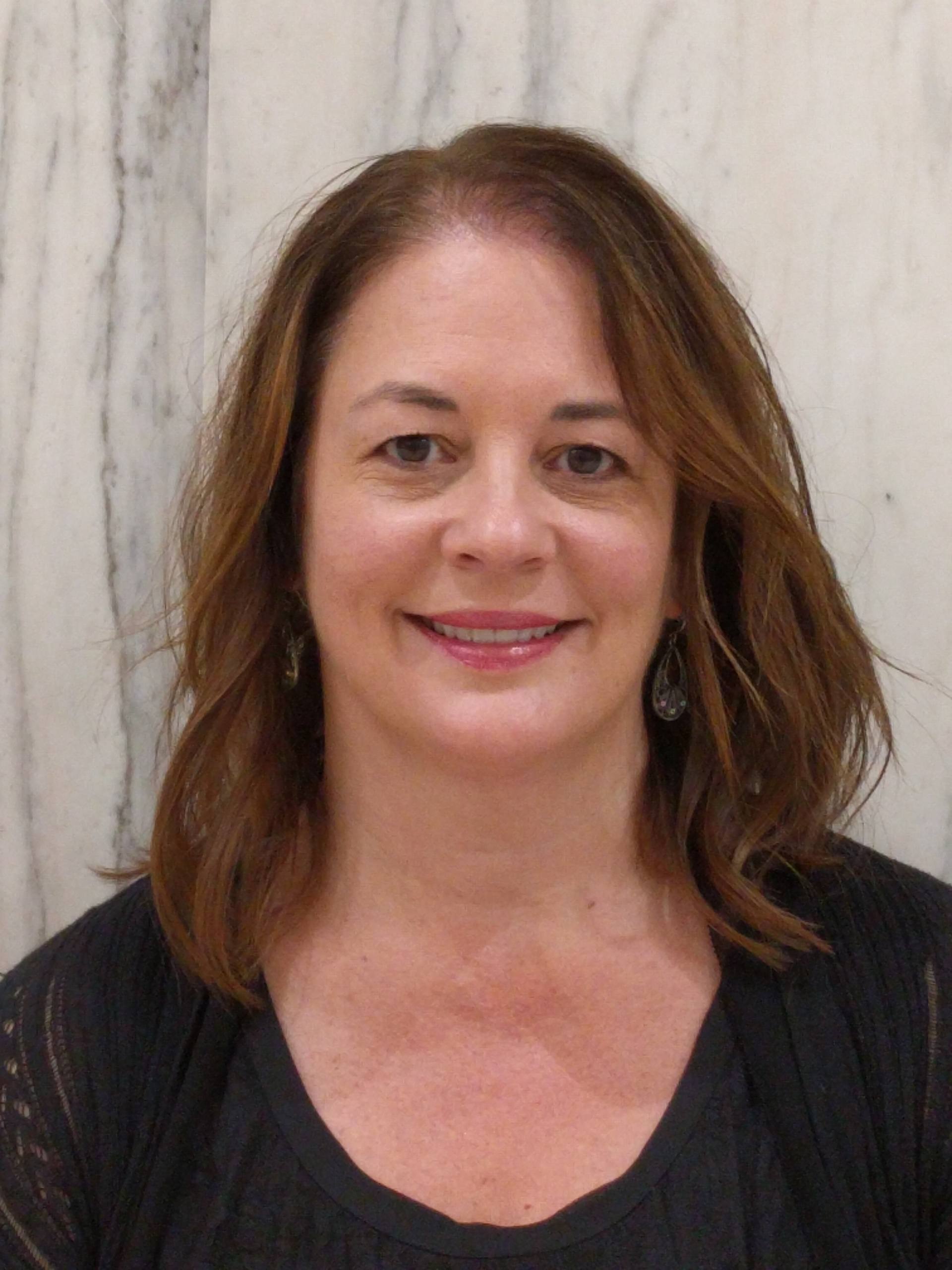 Professional headshot of Tammy Oelkrug wearing a black top