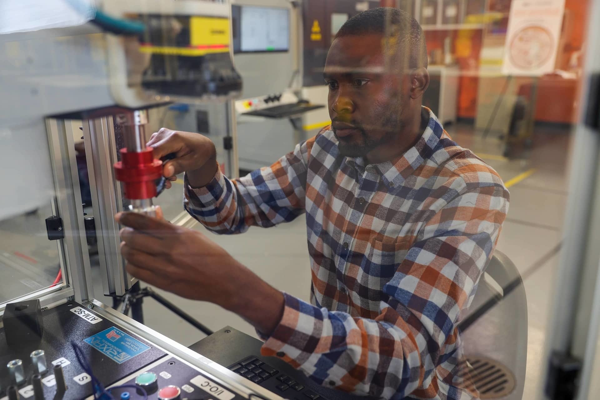 BGSU student working in a mechatronics engineering lab.