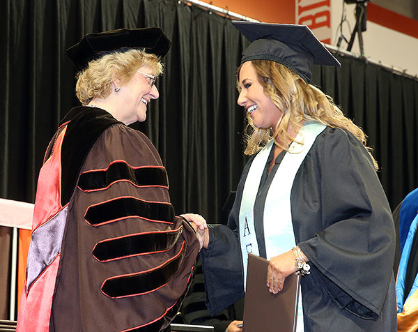 Angelica Mormile receives diploma from BGSU President Mary Ellen Mazey