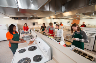 Faculty member Dawn Anderson and students utilize the new Food Science Lab in the College of Health and Human Services.
