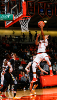 Junior Ismail Ali charges the basket during Falcon basketball at the Stroh Center.