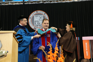 Dr. Thomas Snitch receives an honorary degree May 9 during the Commencement ceremony for the Colleges of Arts and Sciences and Firelands, where he also served as Commencement speaker.