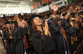 BGSU students celebrate May Commencement at the Stroh Center.