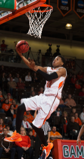 Former Bowling Green State University men's basketball standout Richaun Holmes was selected at pick No. 37 by the Philadelphia 76ers in the 2015 National Basketball Association (NBA) Draft. During his senior season at BGSU in 2014-15, Holmes was tabbed the MAC Defensive Player of the Year, earned a spot on the All-MAC First-Team and was named a 2014-15 NABC District 14 All-District First-Team selection. The 6-10 forward led the Falcons in scoring (14.7), rebounding (8.0), blocks (2.7) and minutes (28.8) per game, as well as in field goal percentage at 56.3 percent shooting on the year.