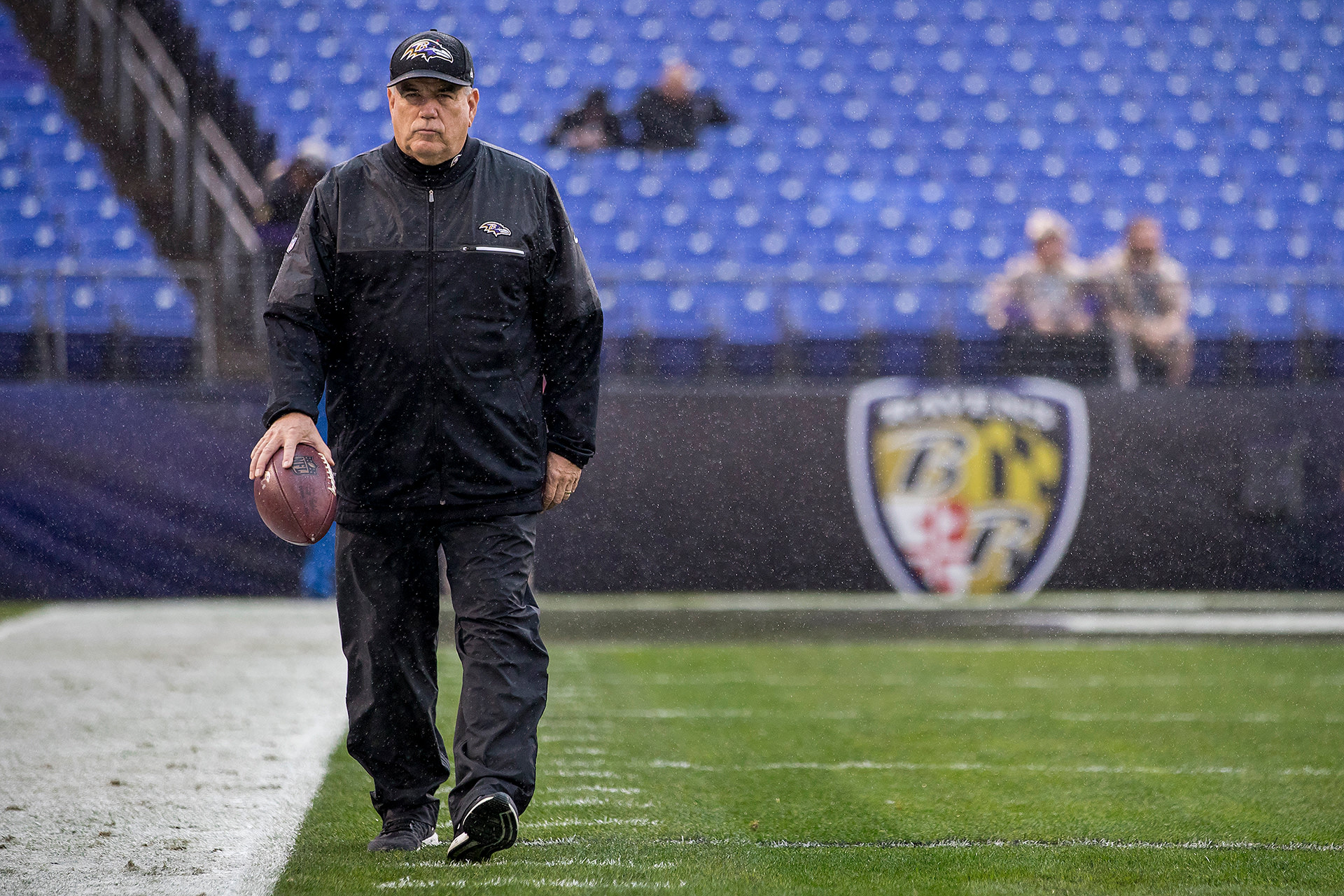 Coach holding football image