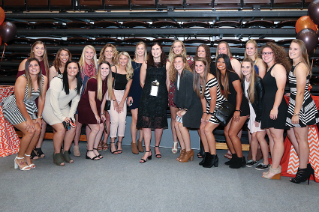 Inductee Liz (Vrabel) Knoblauch ’06 with current members of the Falcon Softball team