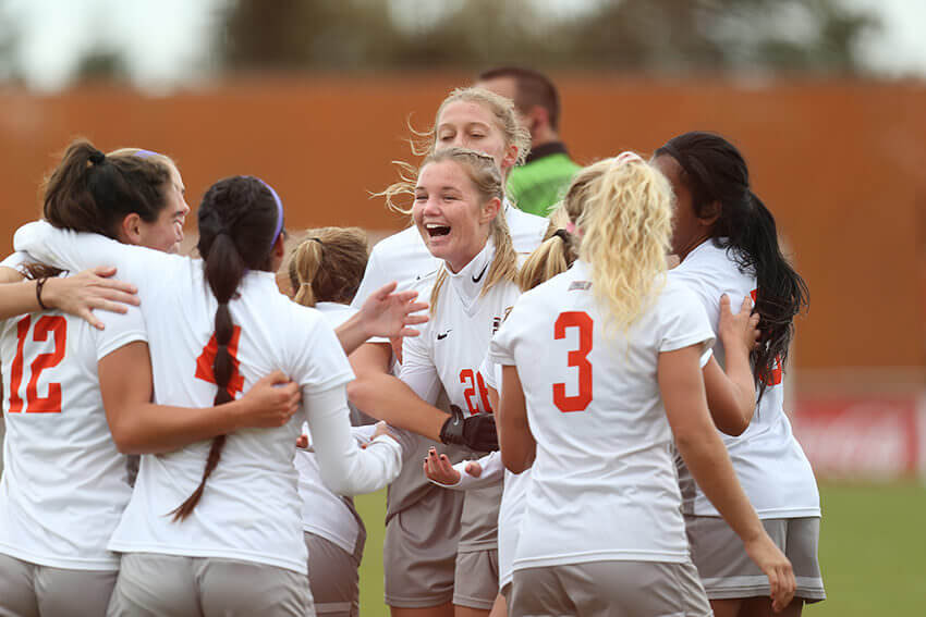 women soccer team celebrating