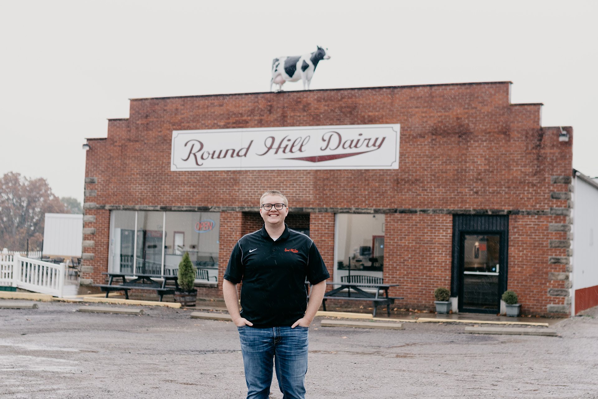 Tyler McCann in front of his shop