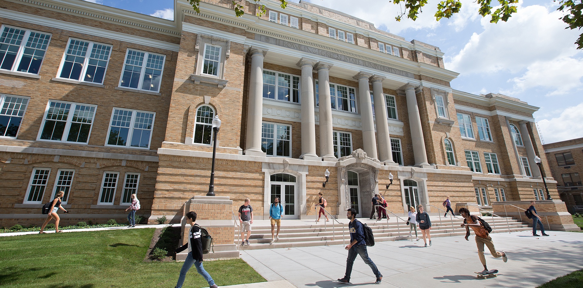 Students walking in front of university hall