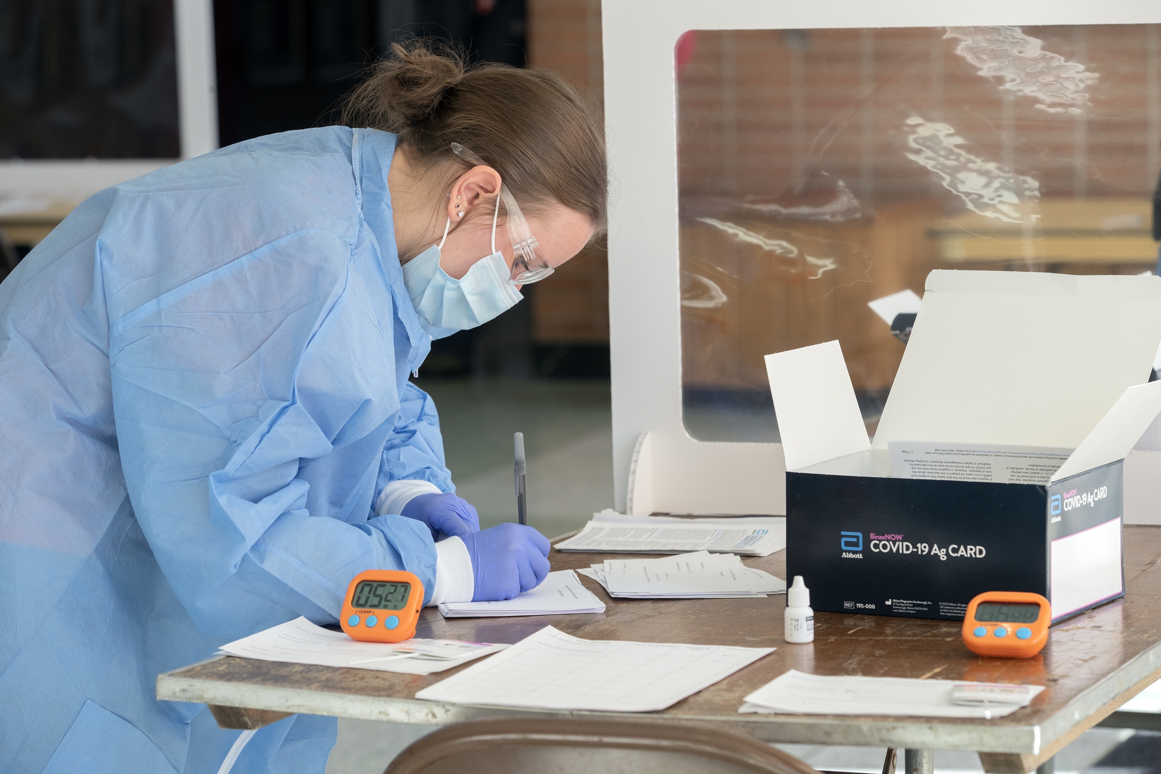 BGSU medical laboratory sciences student Nicole Fischer prepares to administer COVID-19 tests