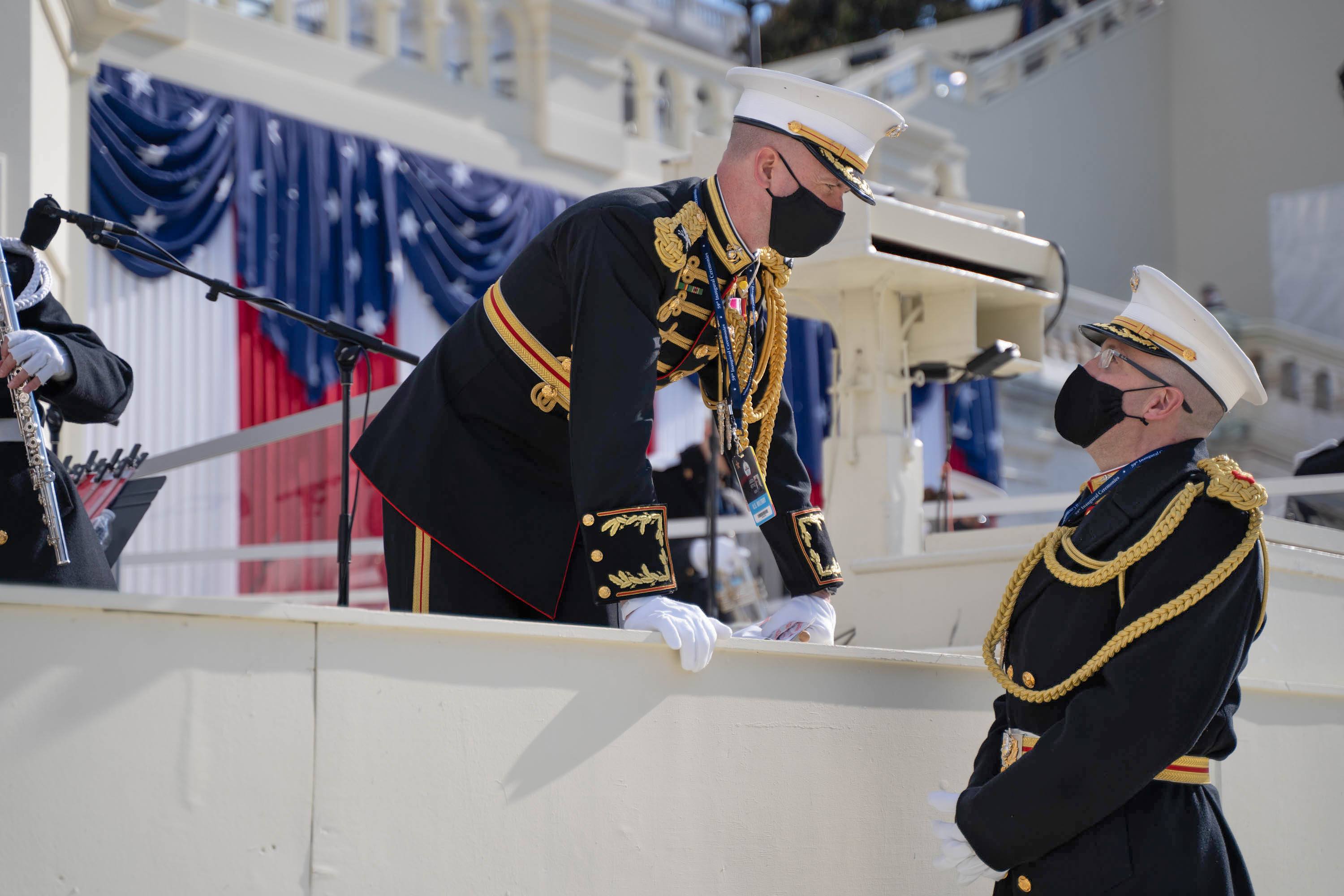 Bowling Green State University alumnus Assistant Director Maj. Ryan J. Nowlin ’00, ’04, right, at the inaugural platform during the ceremony.