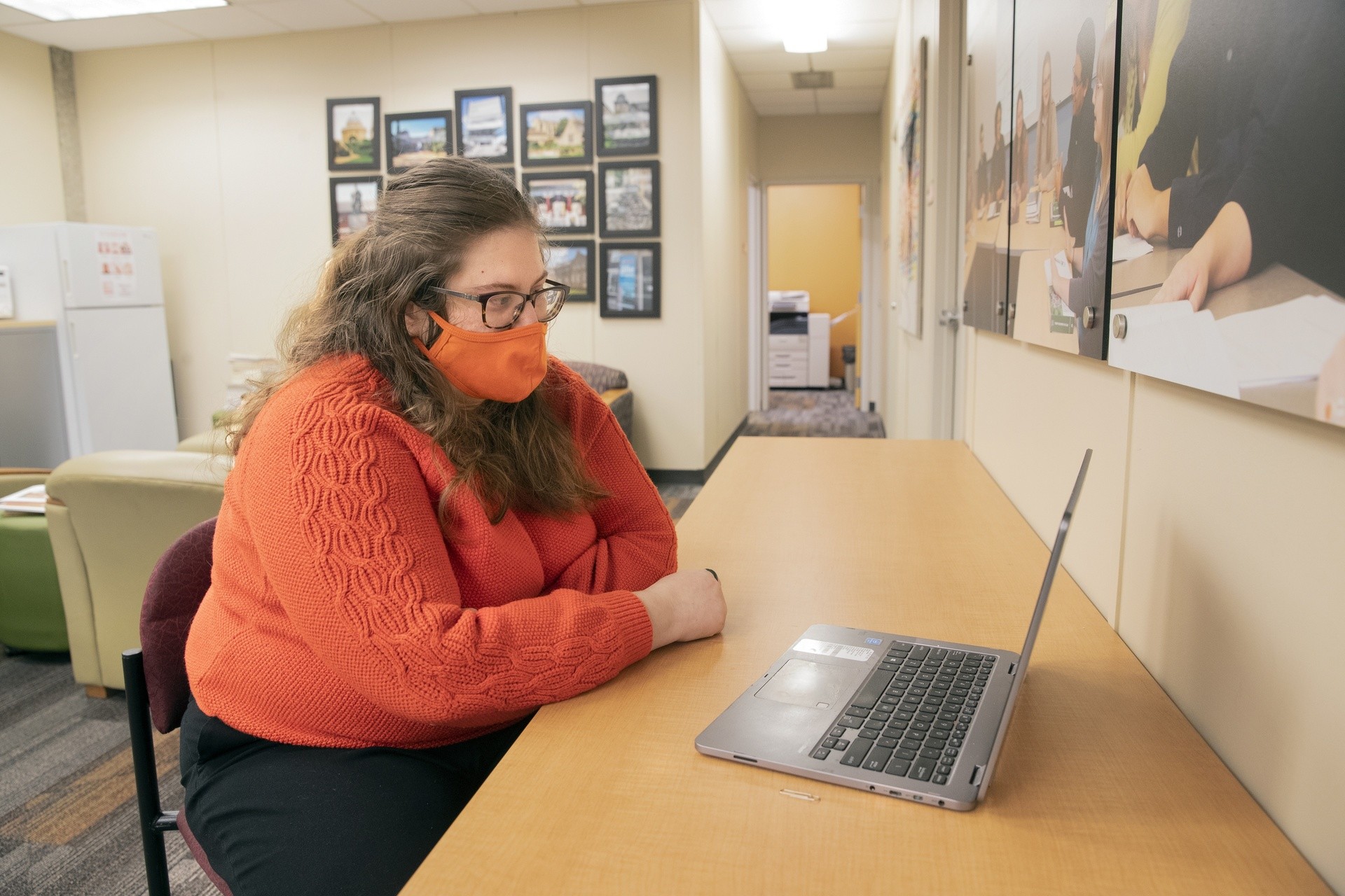 Val Erwin working on her laptop