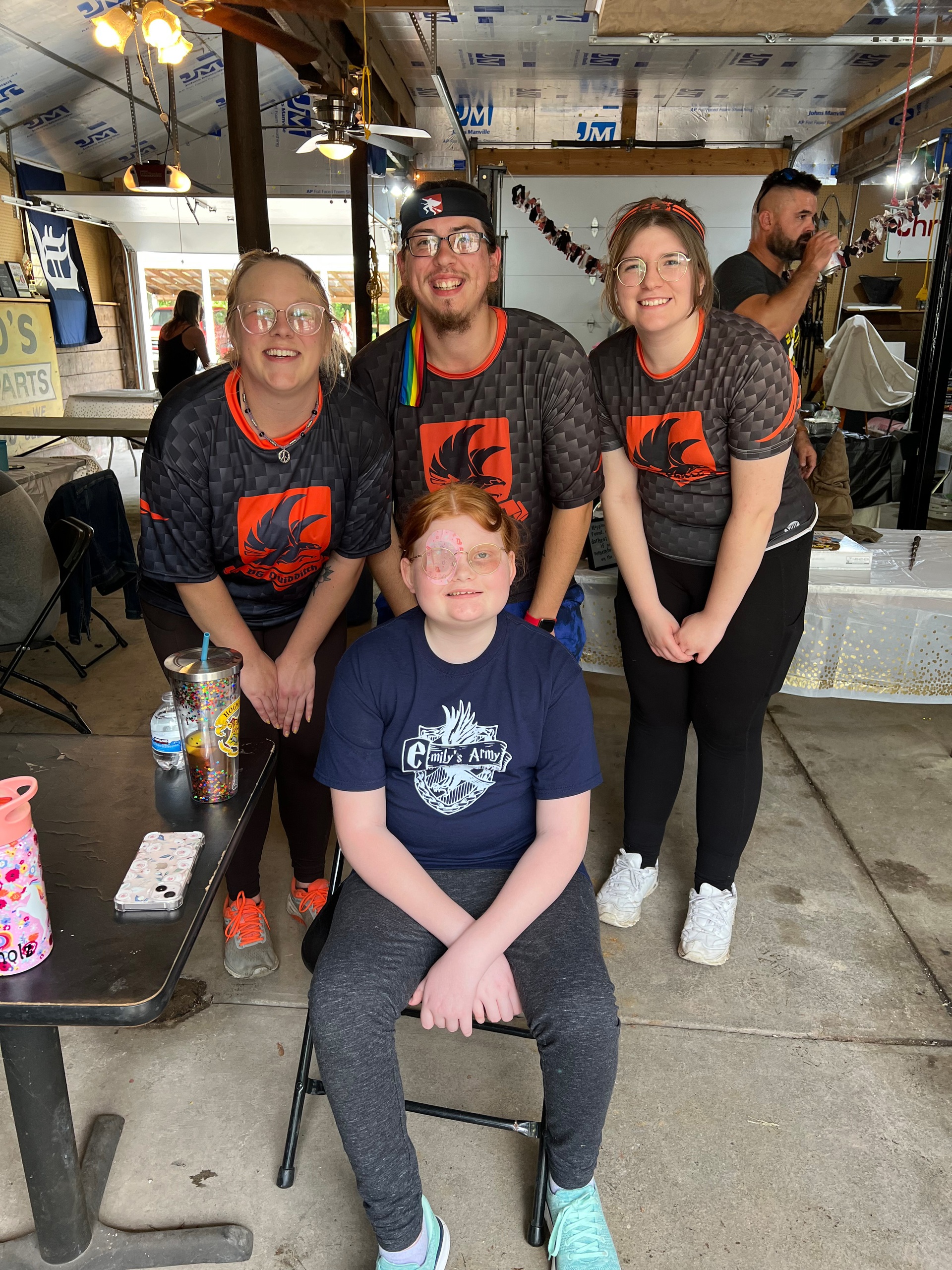 members of the BGSU Quidditch team with 11 year old at their end-of-radiation party