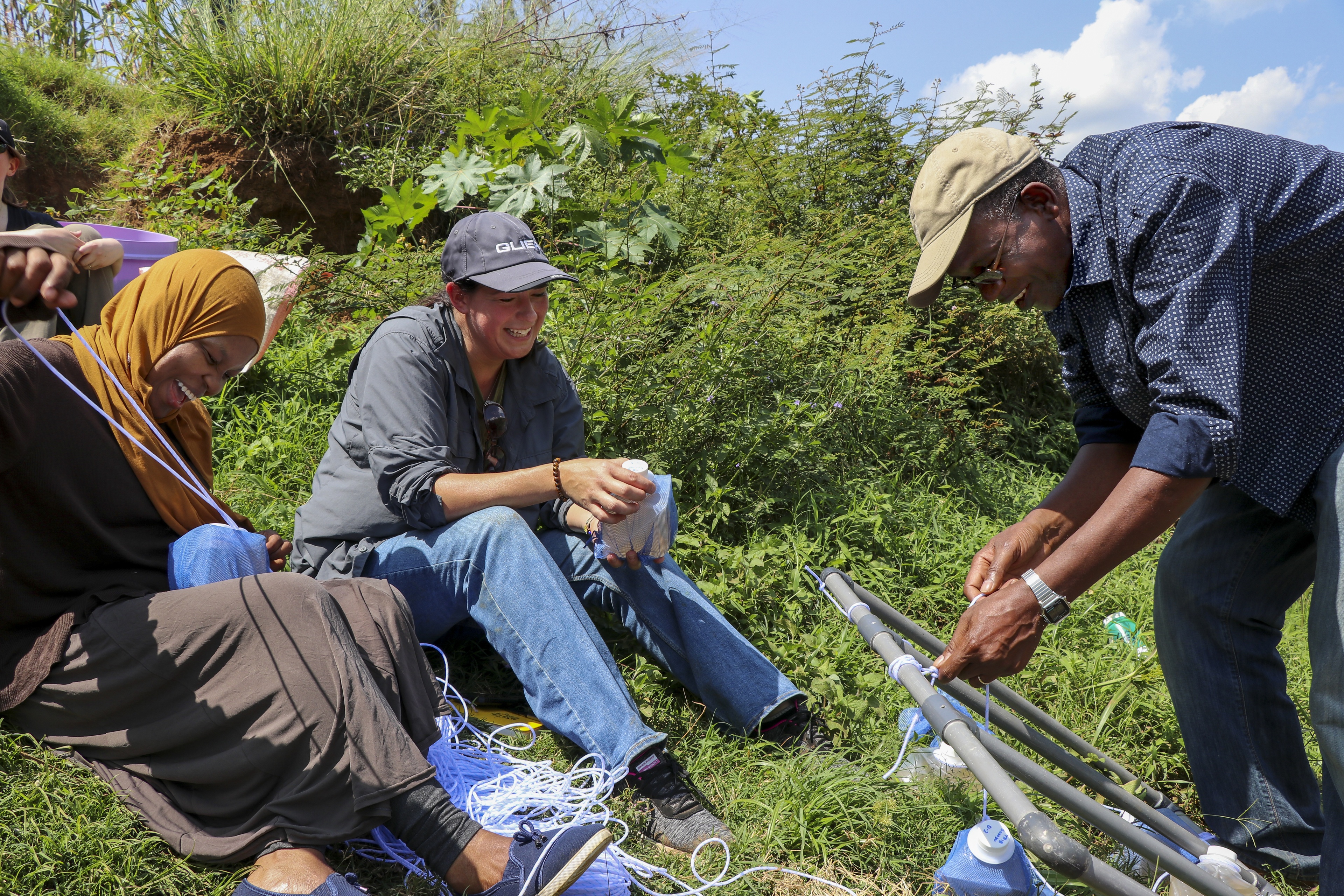 Dr. Kefa Otiso, right, works on a research project during the June research trip to Kisumu, Kenya.