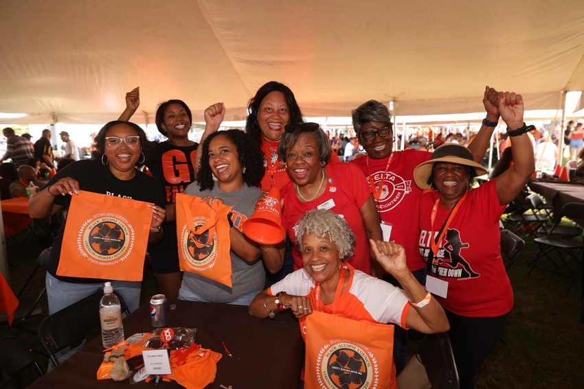 Black Alumni Council members rally together during tailgate.