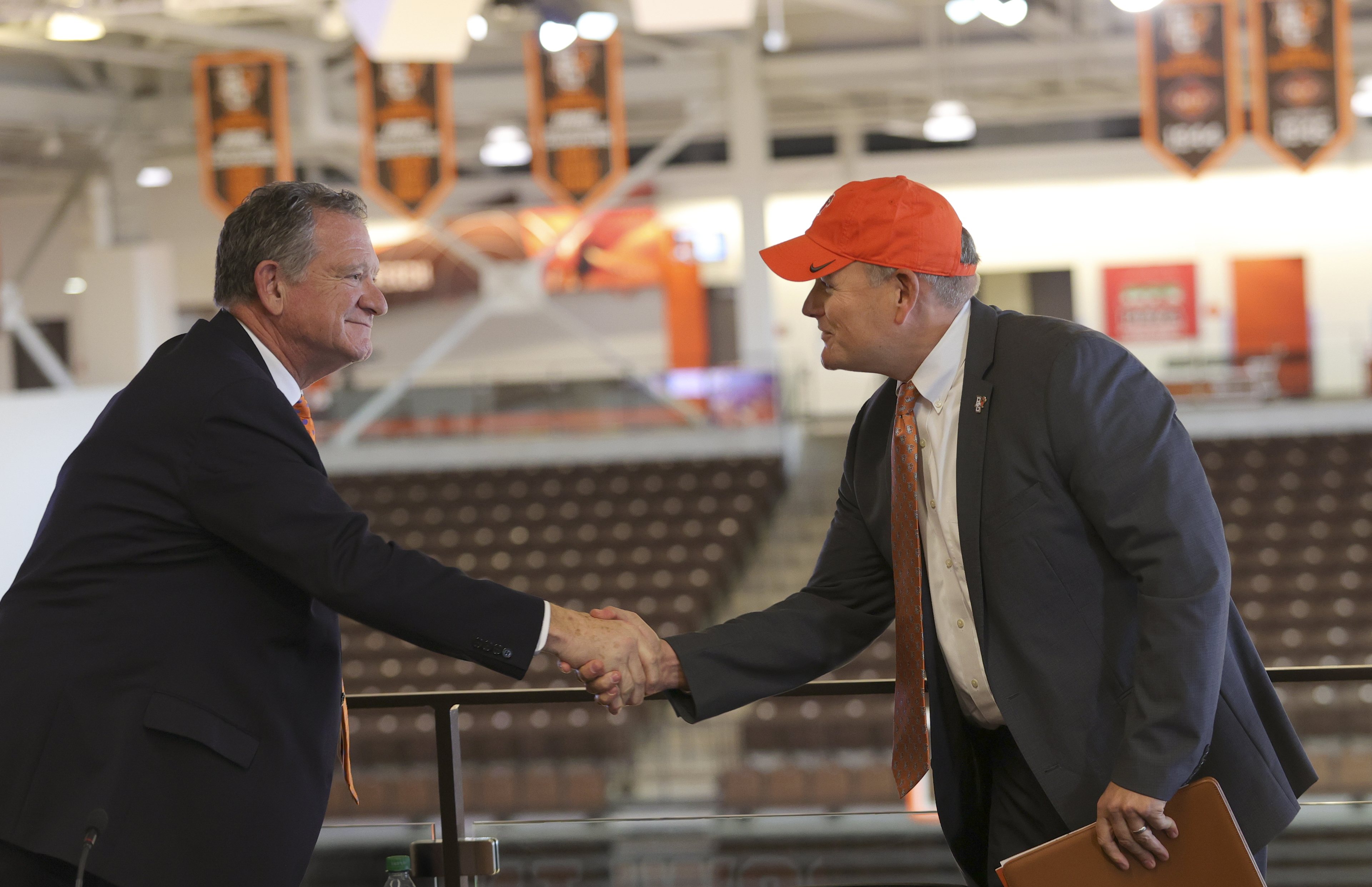 Derek Van Der Merwe shaking hands with President Rogers