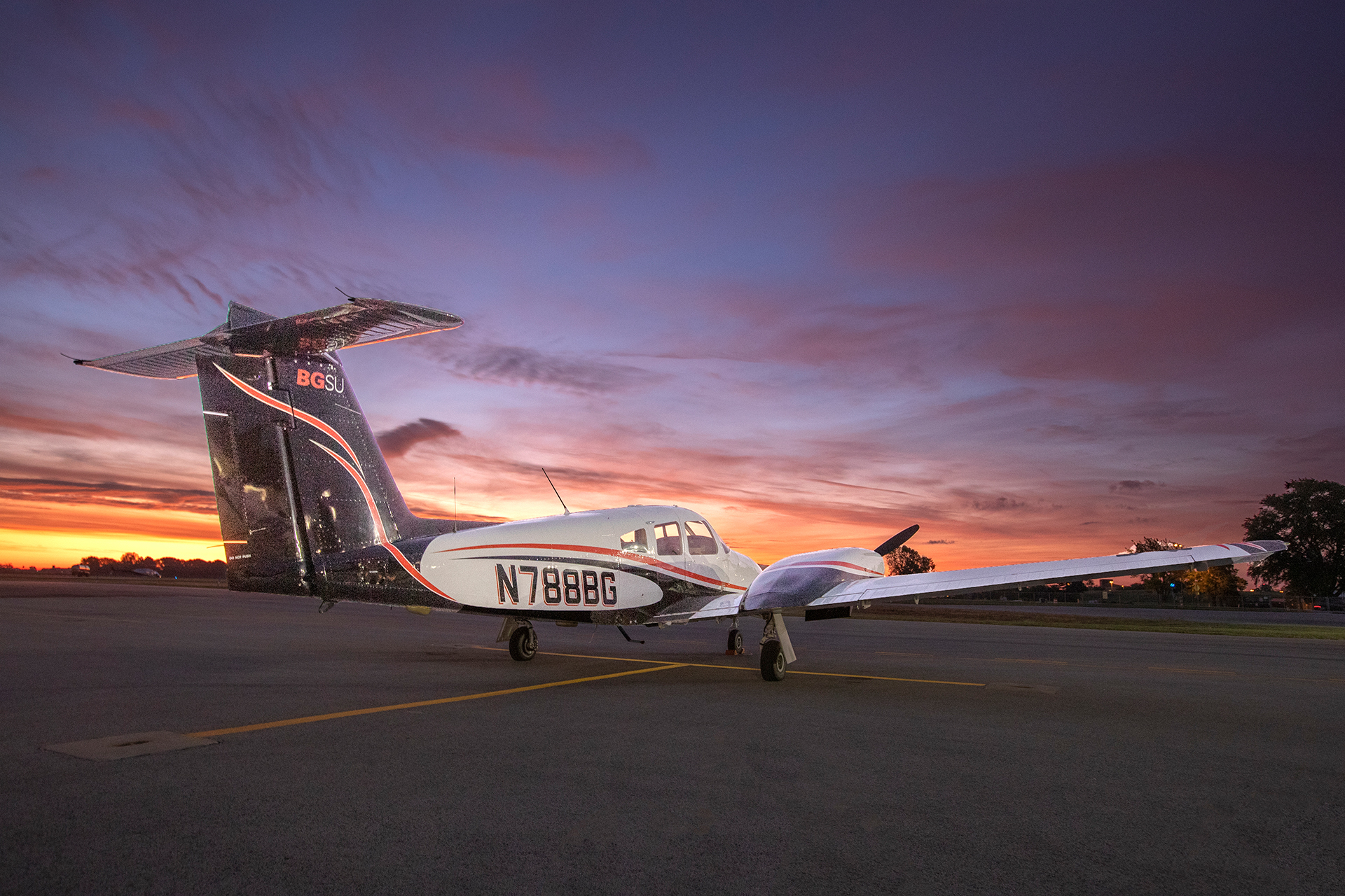 Plane on the ground at sunset