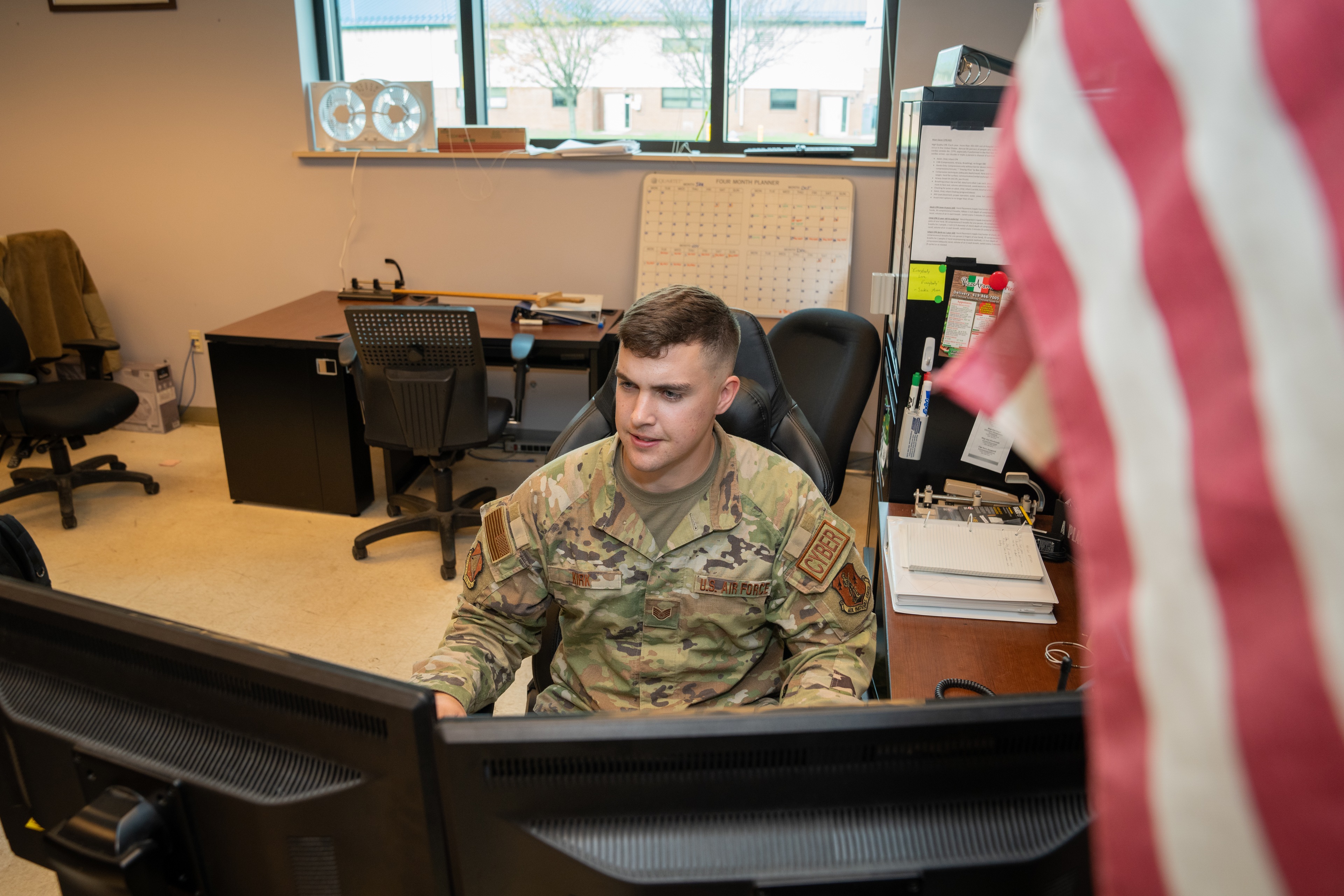 Chase sitting at desk