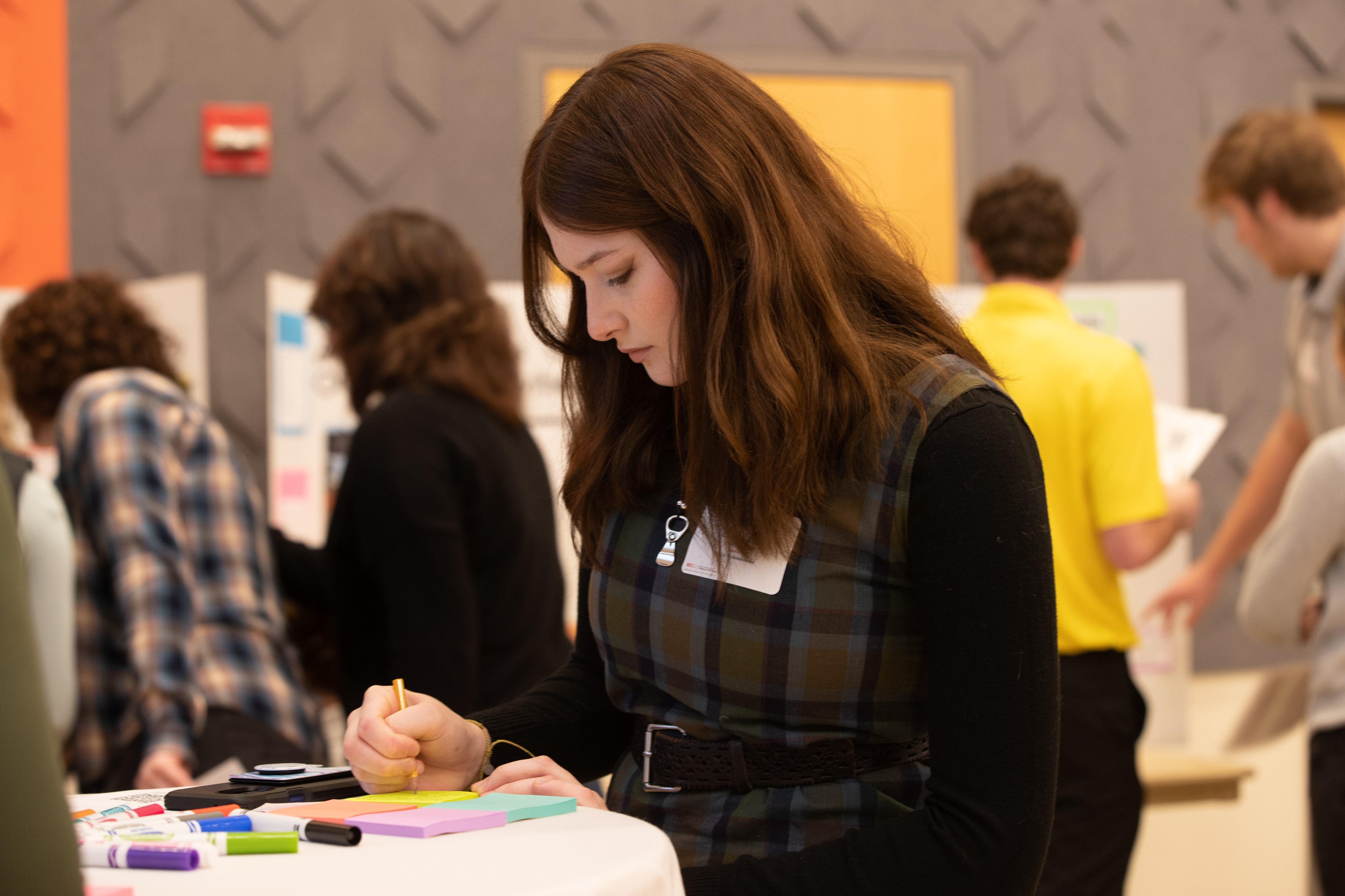 Encouraging post it notes placed of student pictures