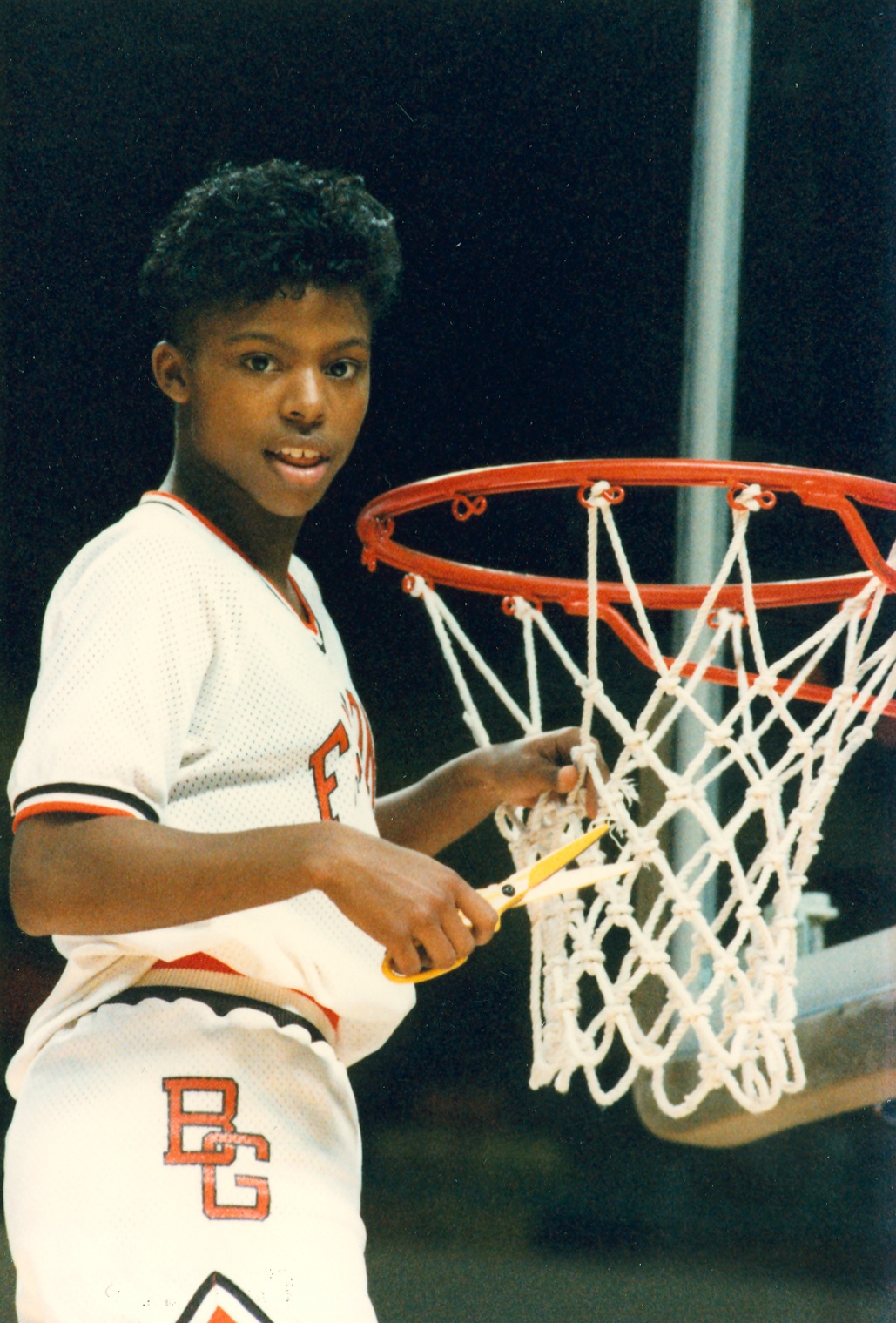 BGSU women's basketball player Paulette Backstrom cuts down a net