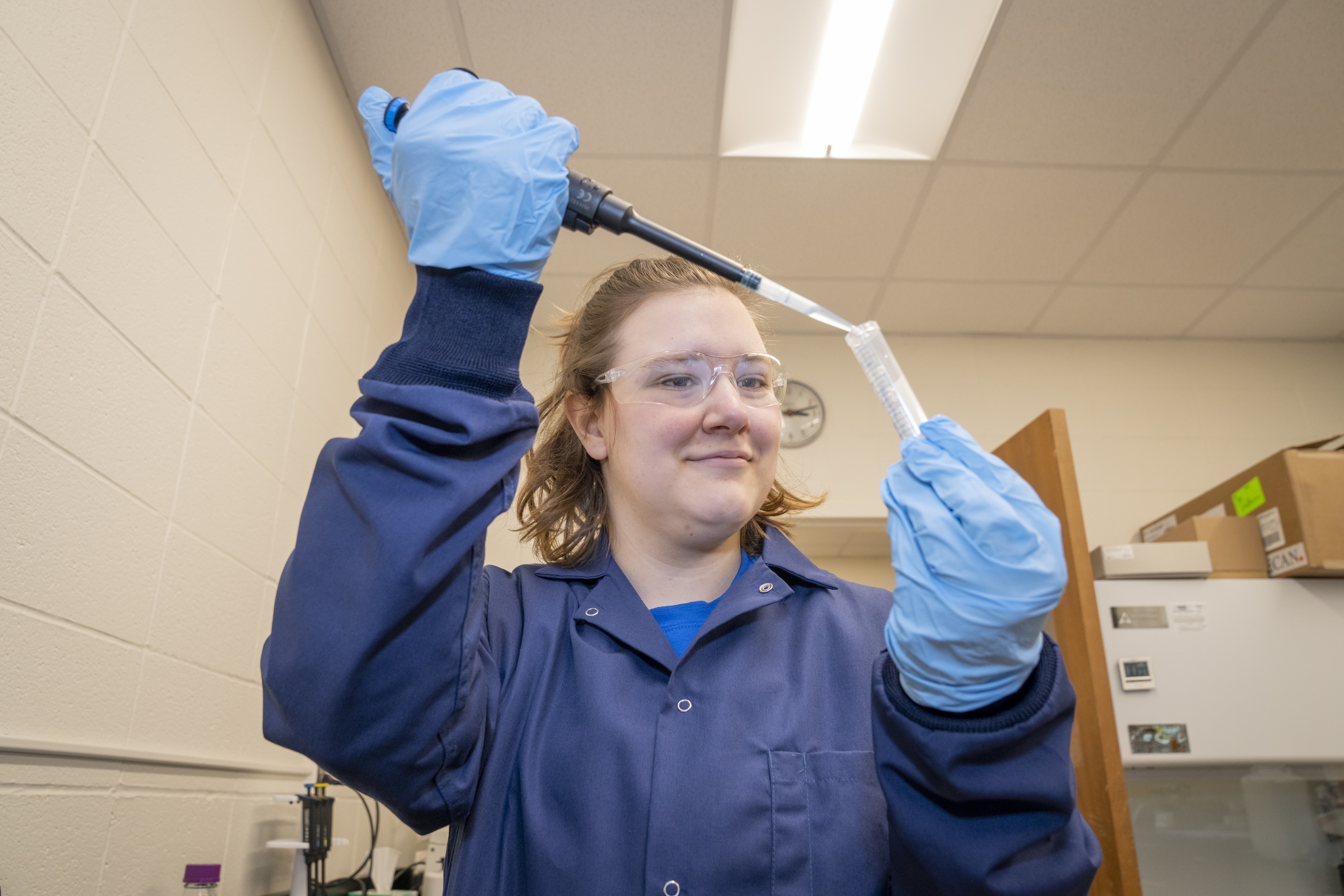 Margaret squeezing plankton into a test tube