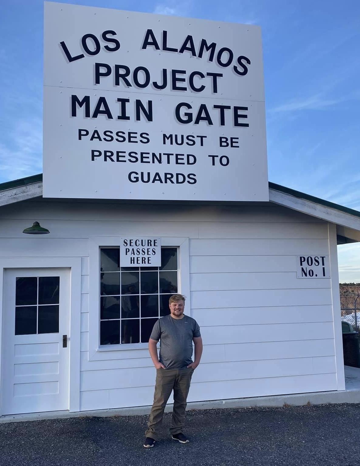 BGSU alum outside entrance to Los Alamos National Lab in New Mexico.