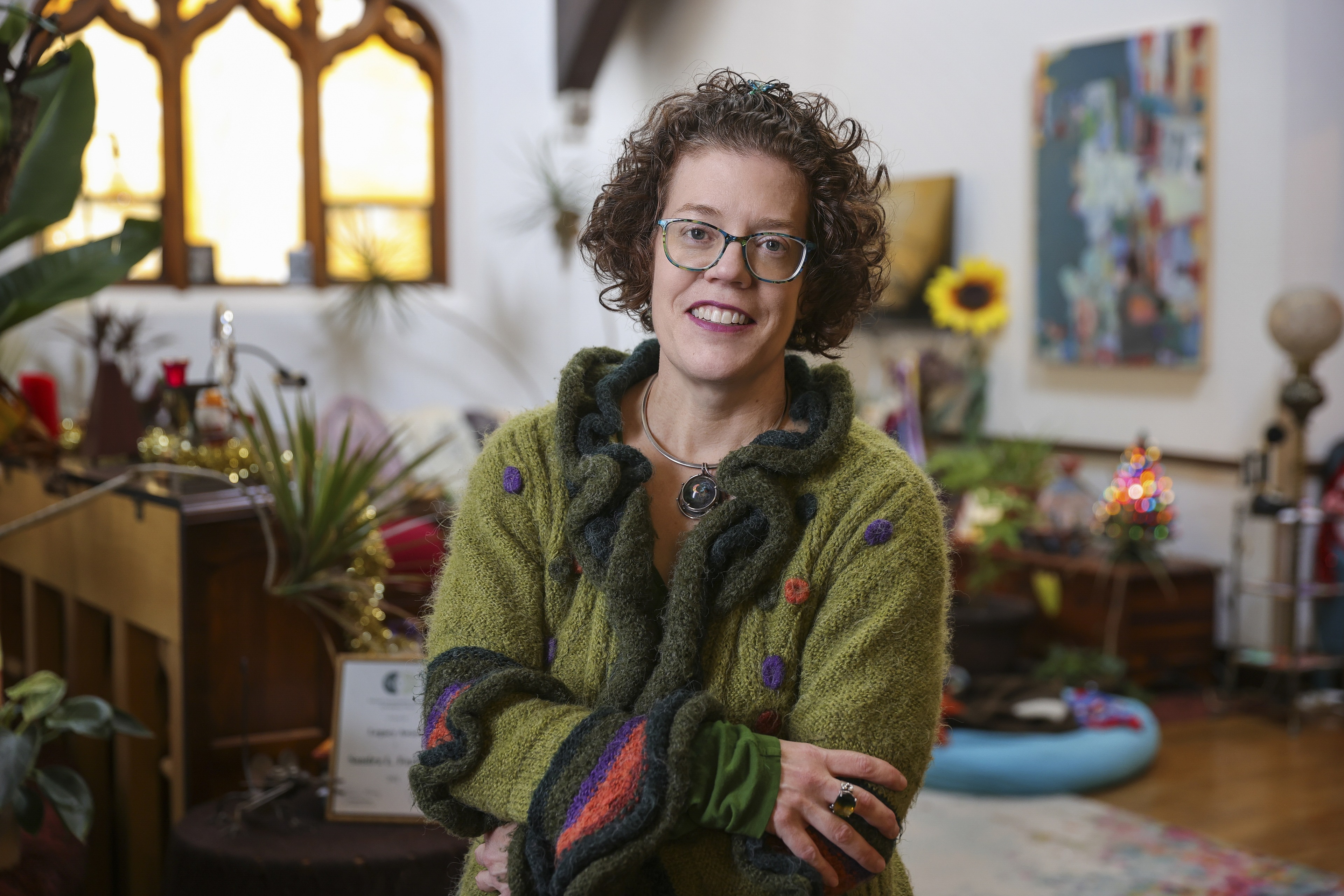 BGSU professor Dr. Sandra Faulkner stands with her arms crossed in her home