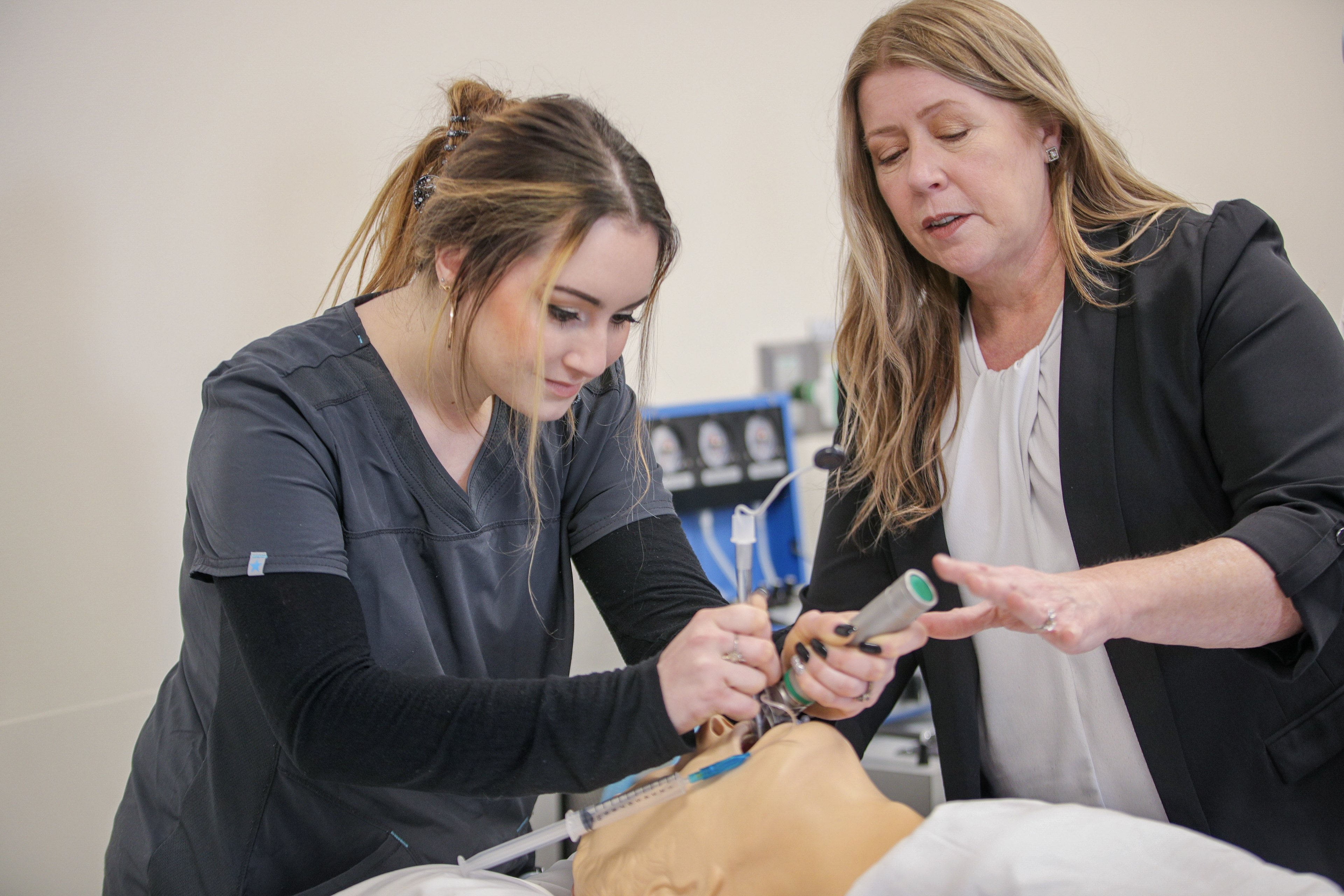 two people working in the Allied Health Respiratory Care skills lab