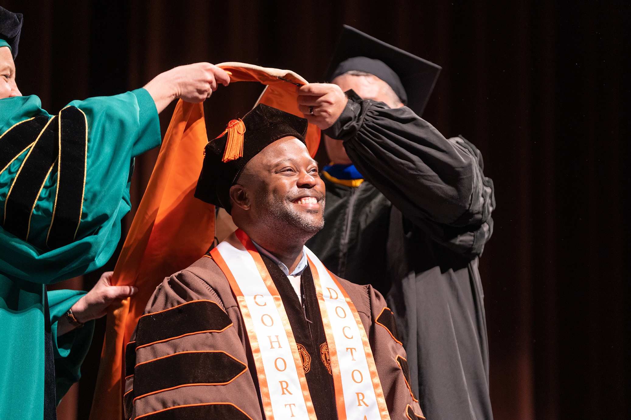 BGSU doctoral student receives a hood 