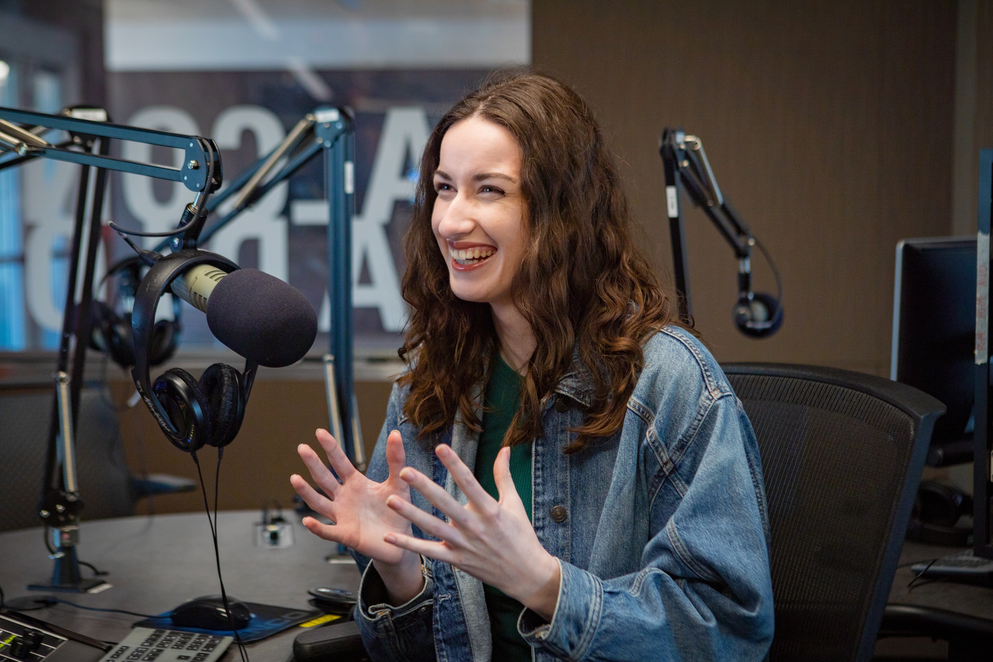 Taylor Kitchen sits in front of a microphone.