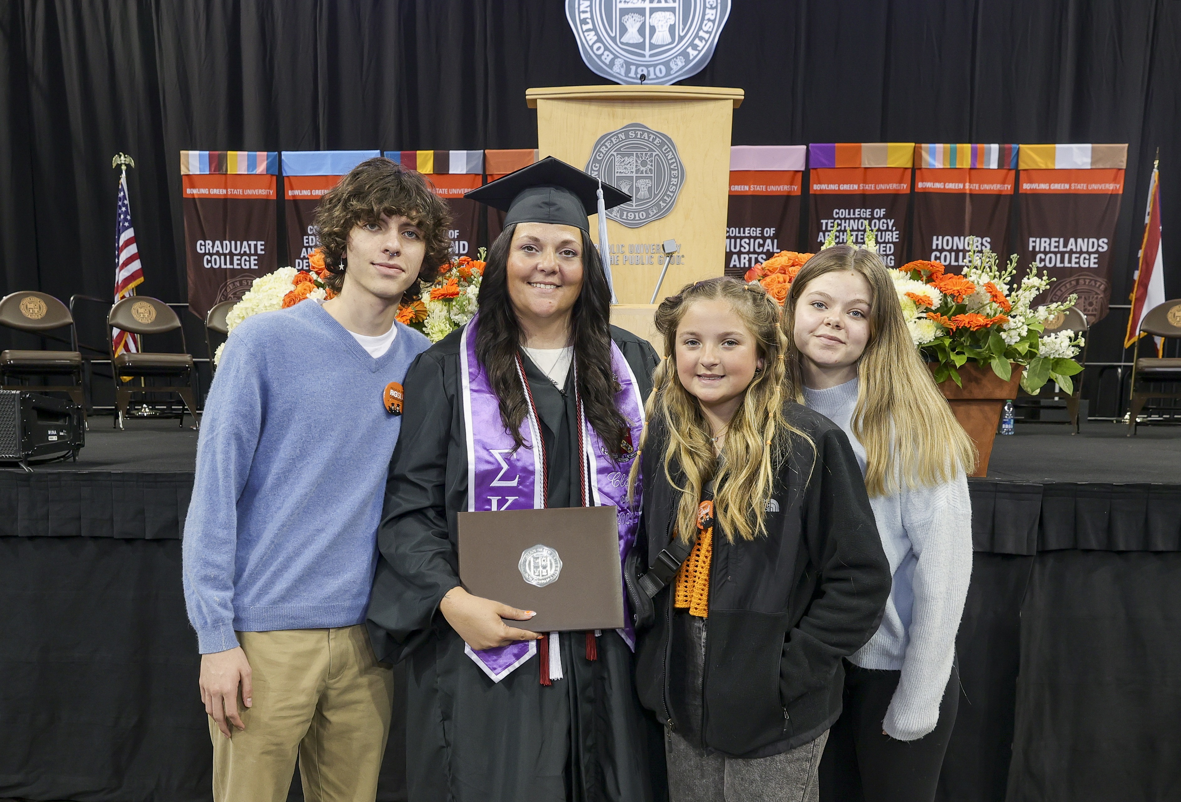 graduate shaking President Rogers hand