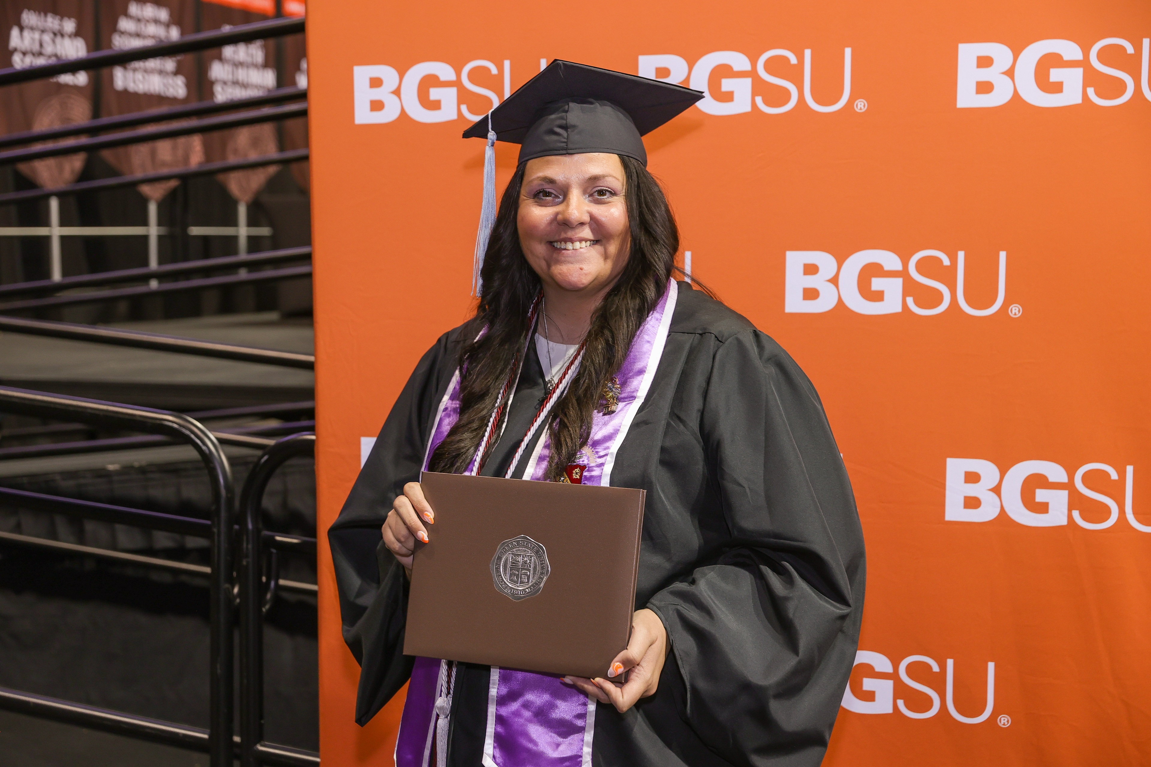 gradate smiling with diploma