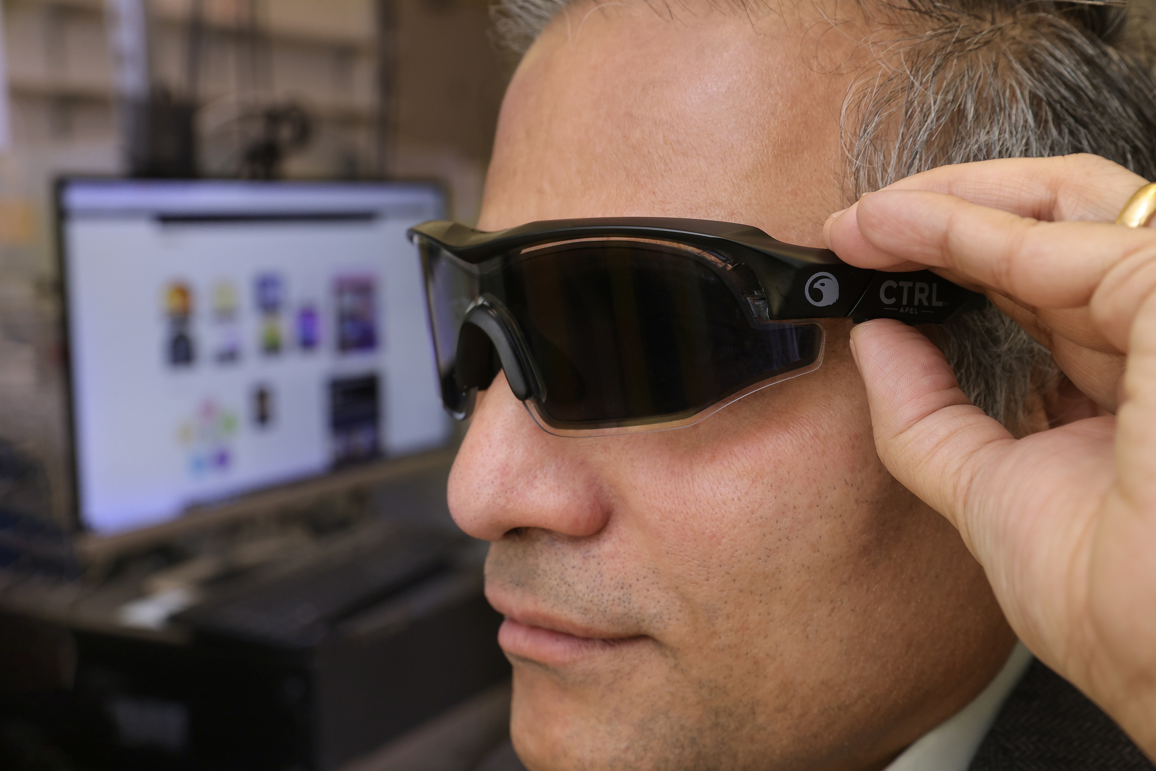 Dr. Jayaraman Sivaguru shows eyewear developed for U.S. Defense Department