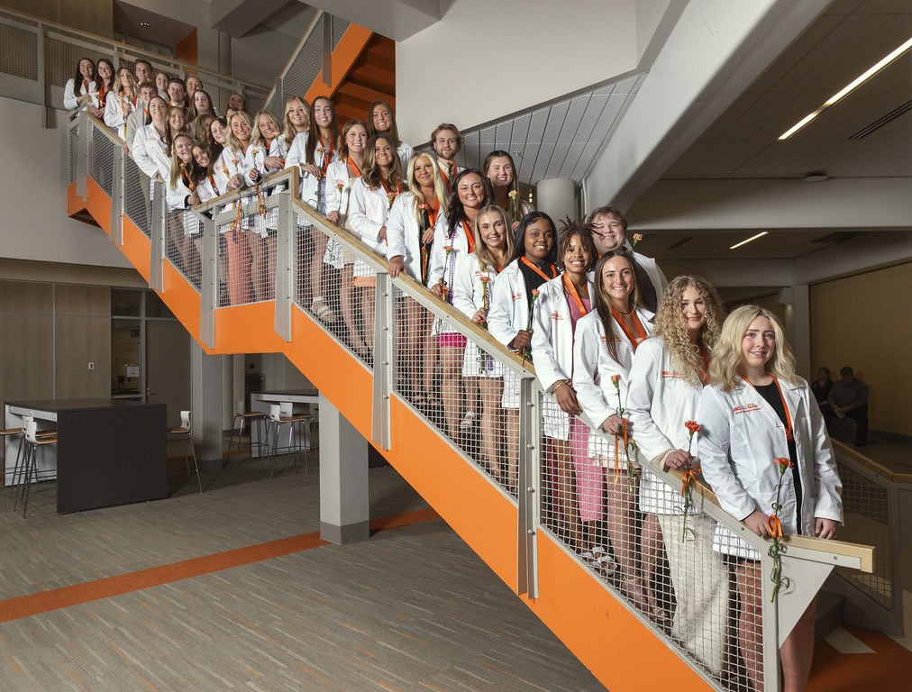 First cohort of 37 Nursing students lined up on stairway