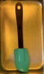 A baking spatula in a cake tin