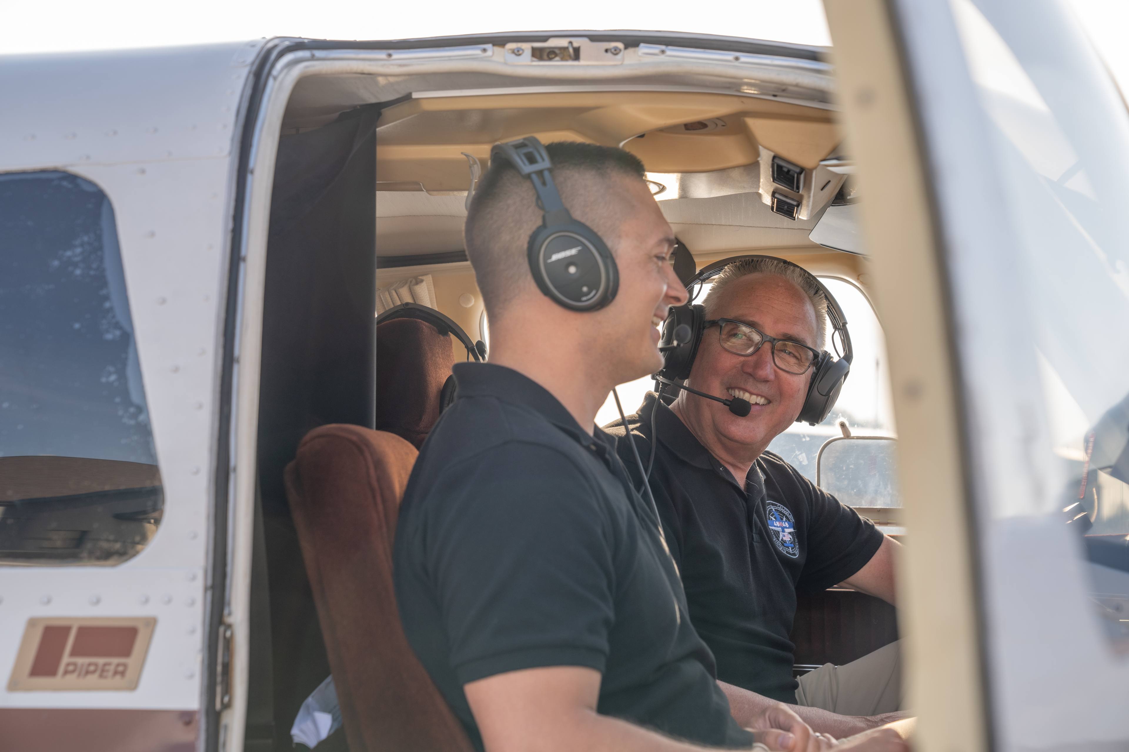 Two men in an airplane.