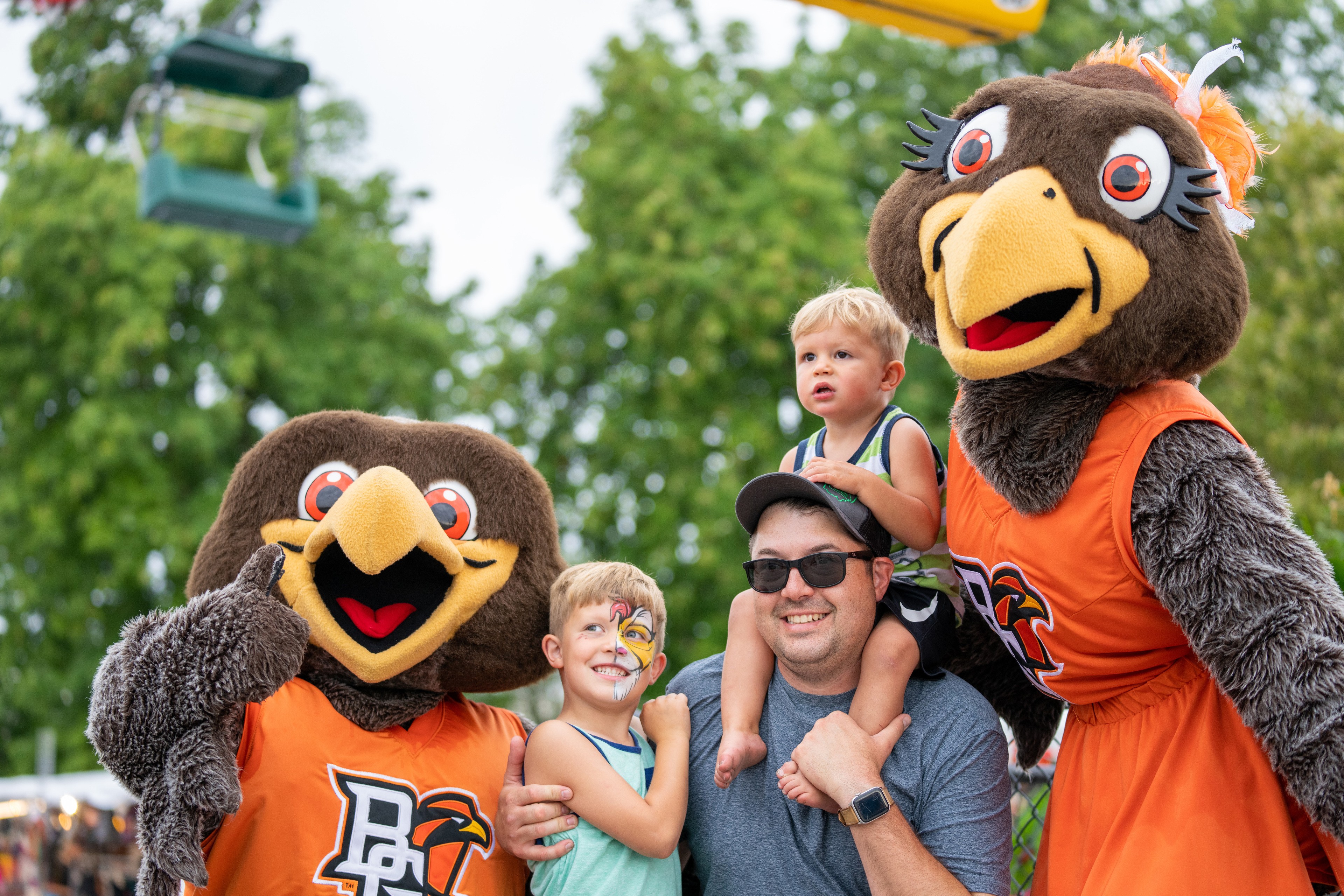 Freddie and Frieda Falcon pose with fans at the Ohio State Fair midway.